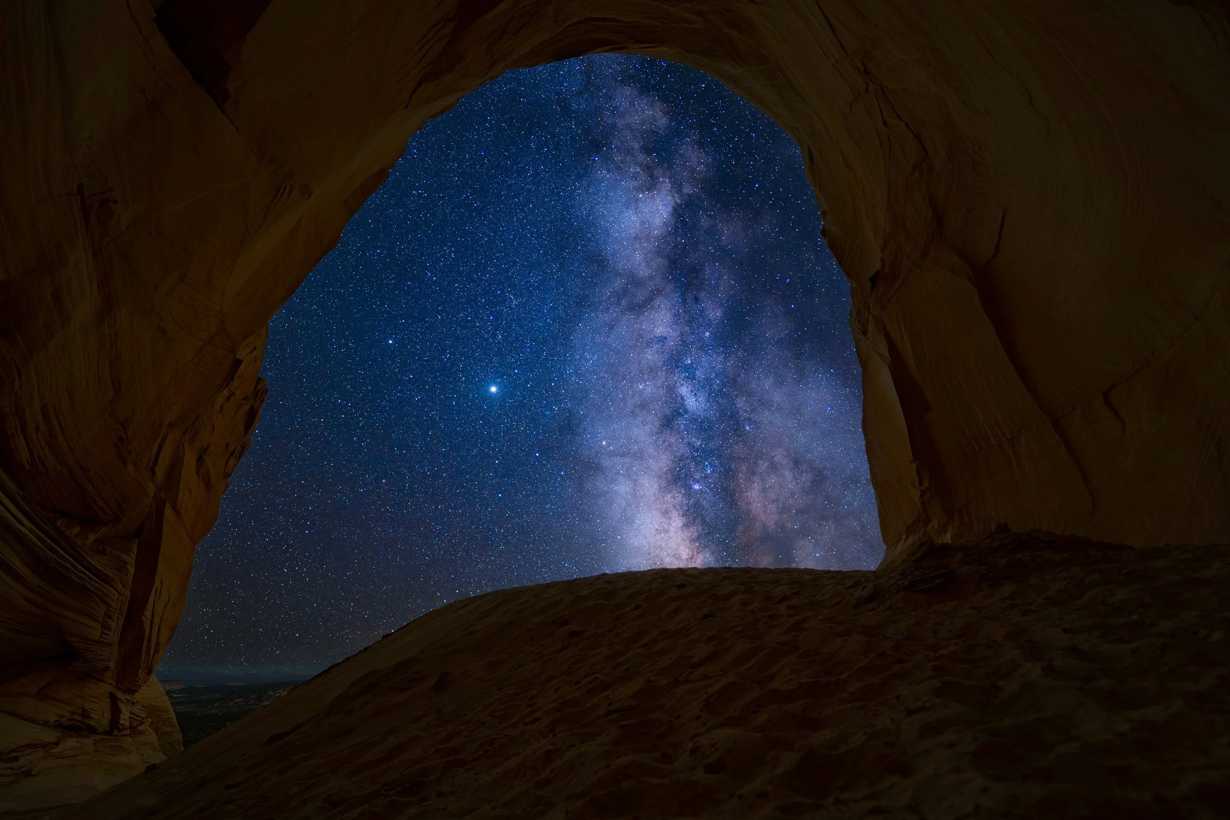 milky way galaxy inside of rock window