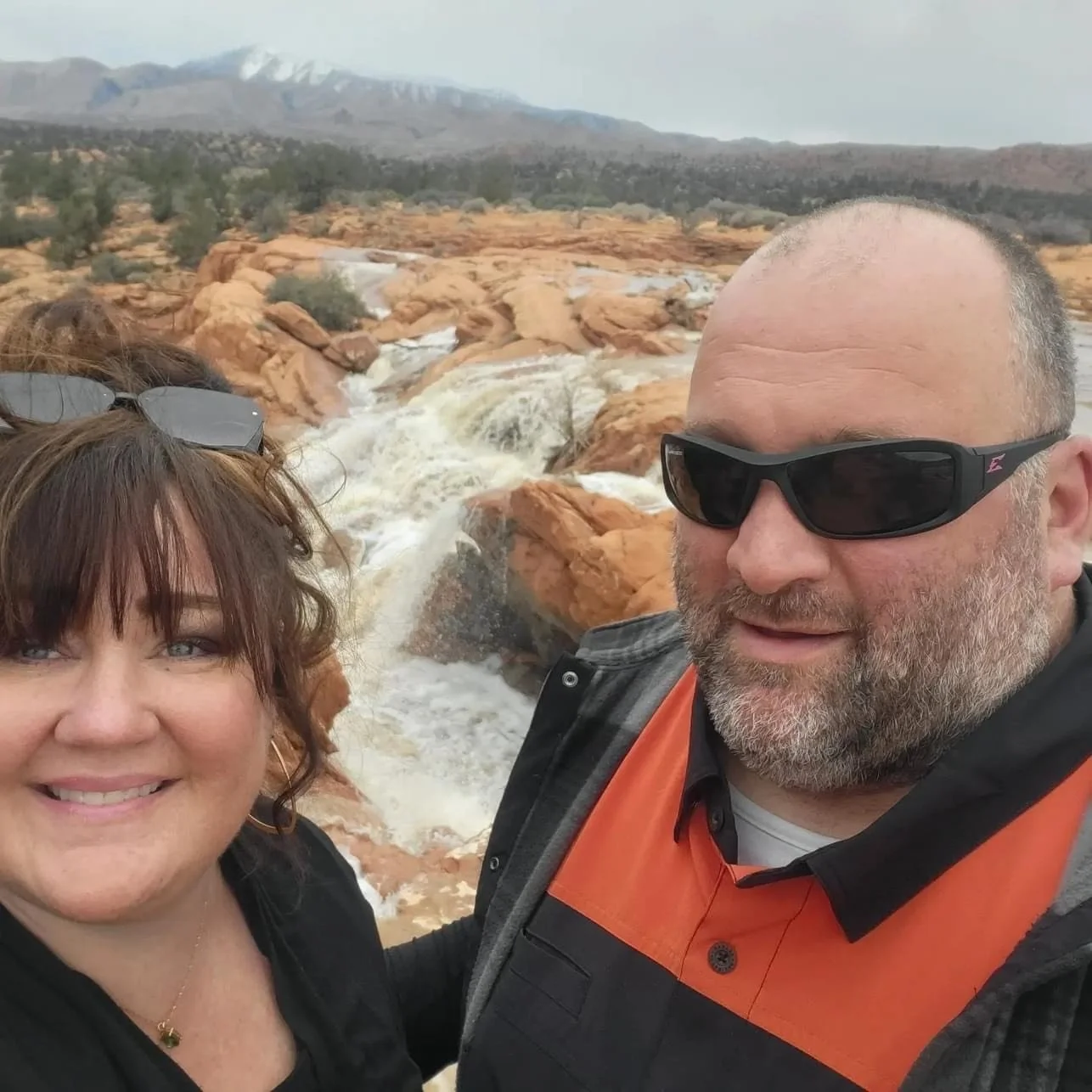 Brandie and husband traveling with river in the background