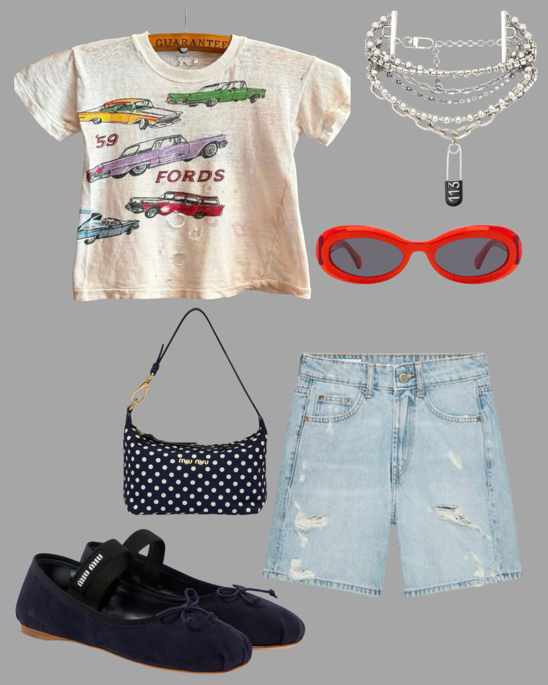 Casual outfit including a vintage Ford car graphic t-shirt with punctures, distressed denim shorts, red sunglasses, a polka dot handbag, navy ballet flats, layered silver pearl and chain jewelry, and red oval sunglasses, all arranged on a gray background.