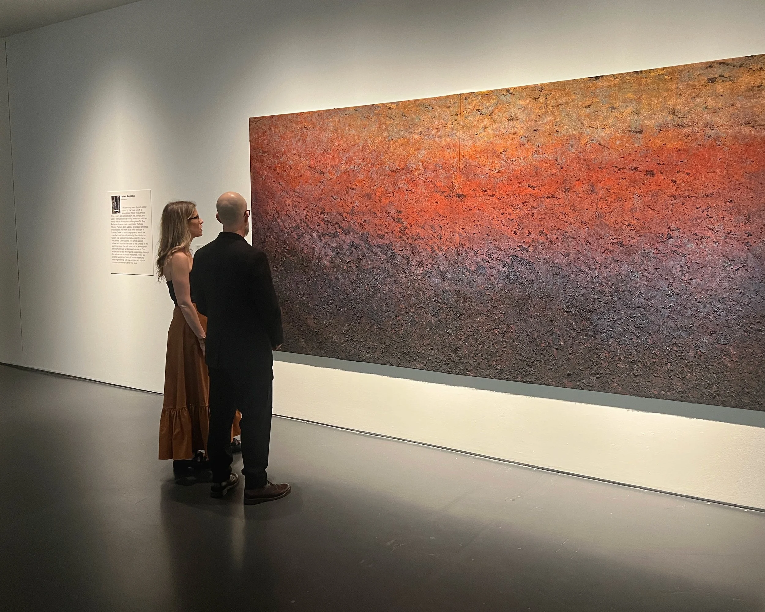 A Spell, 2025. Acrylic and oil with AMD pigments and bituminous coal on canvas, 72 x 144 x 1.5 inches