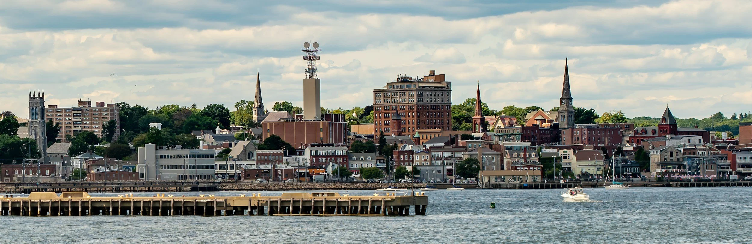 Connecticut harbor town with church steeples seen from the water