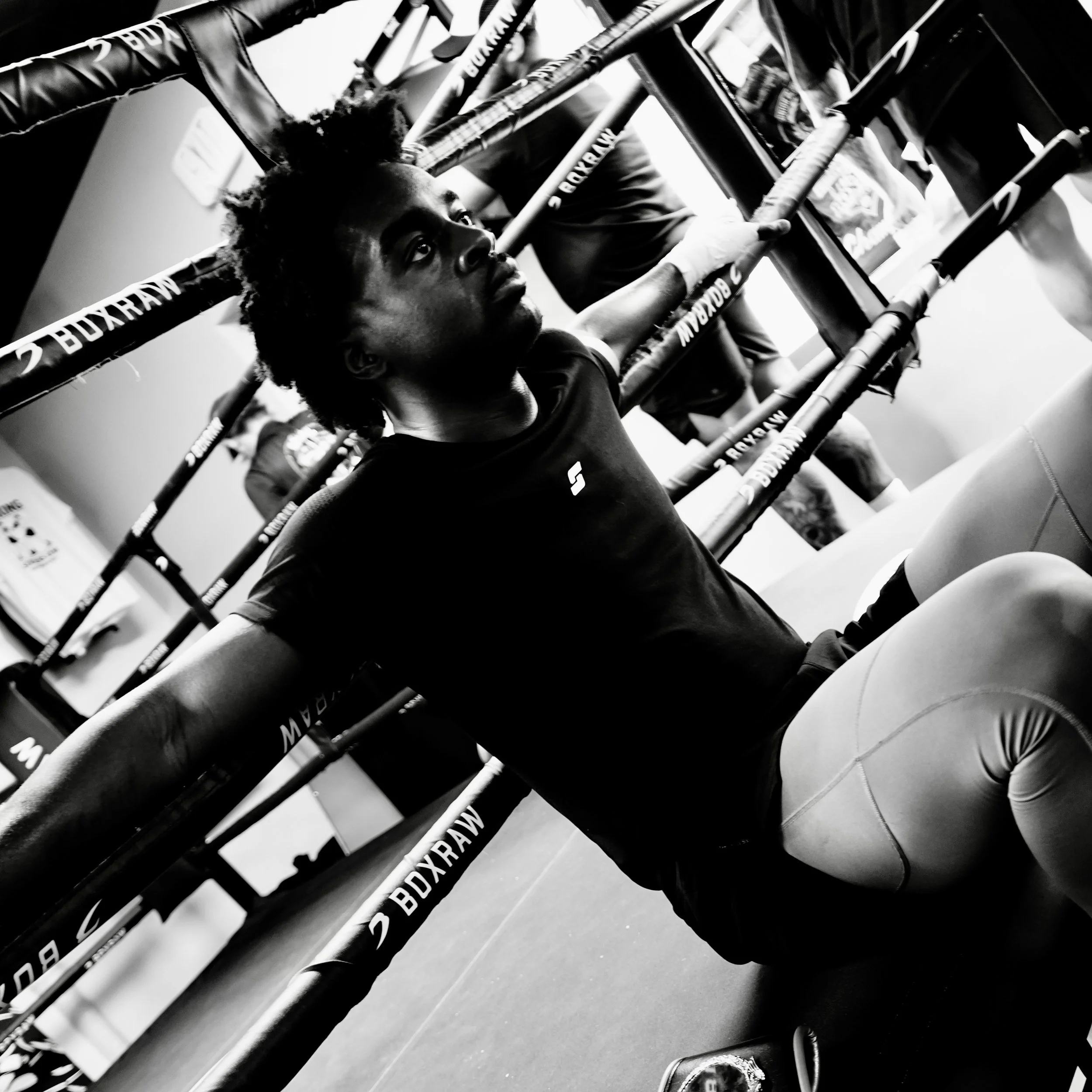 Samuel "S3" Arnold III resting ringside after a boxing workout during fight camp training.