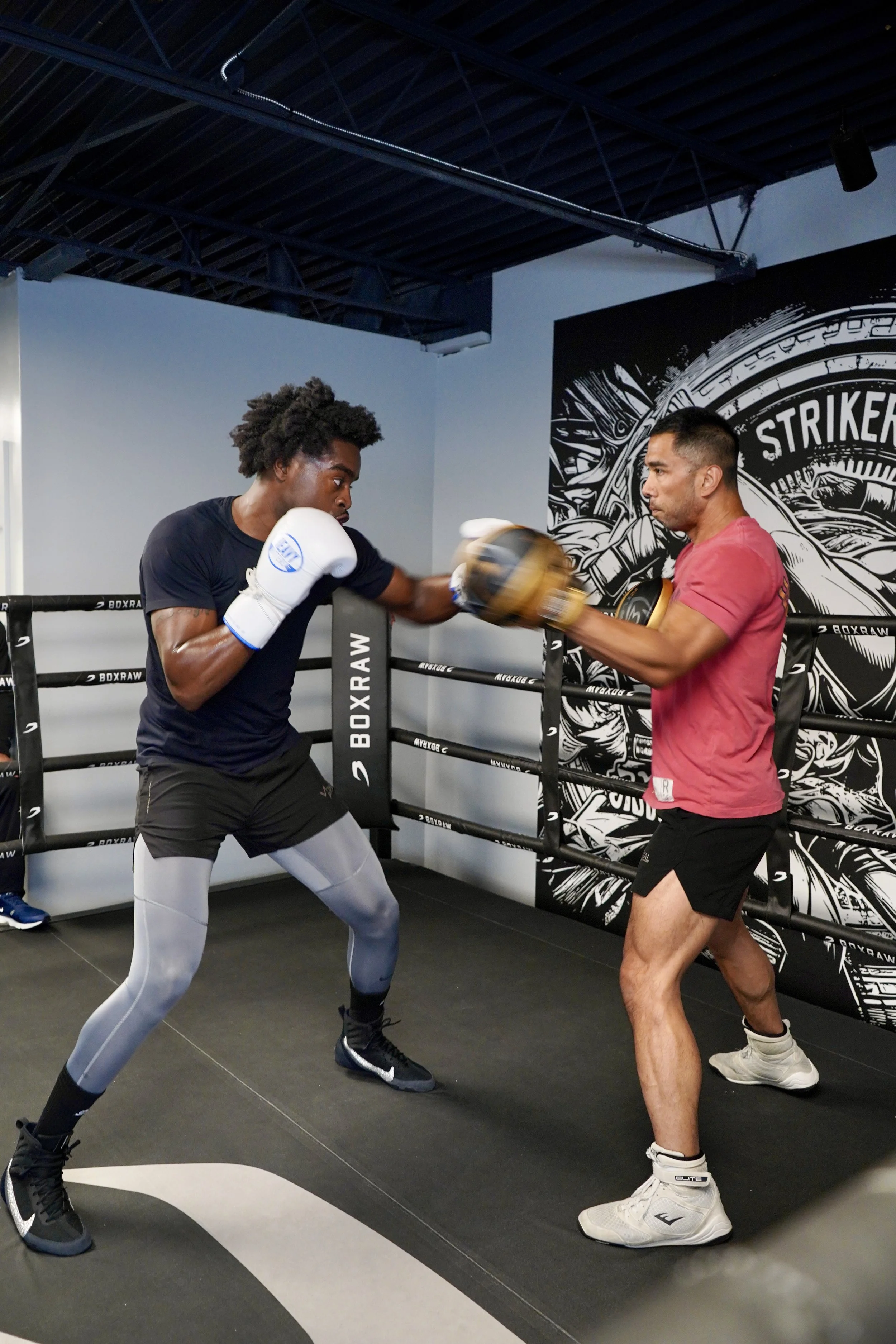 Samuel "S3" Arnold III works the mitts with trainer John Pruna at Strikers Gym in Dallas, Texas.