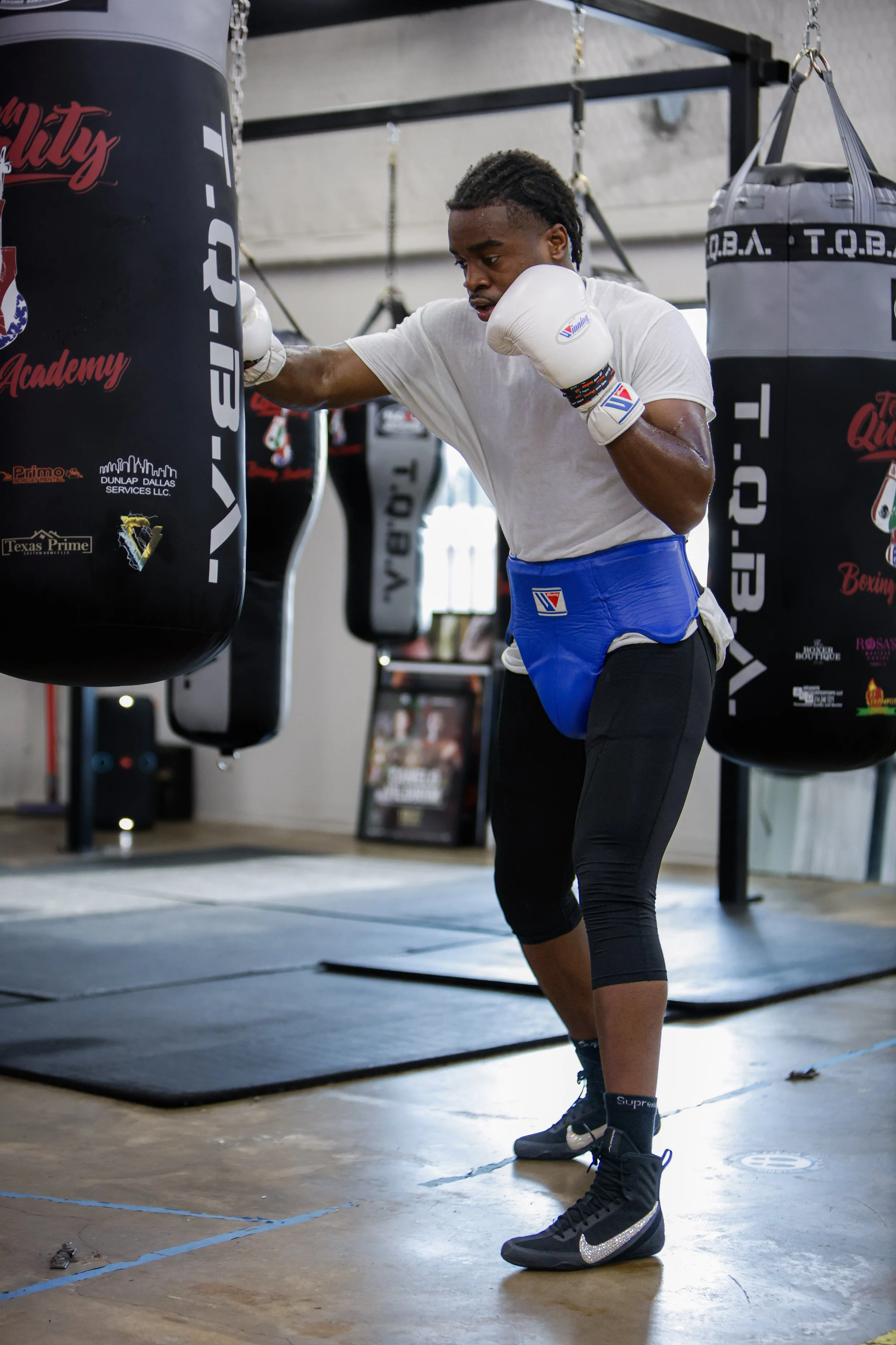 Samuel "S3" Arnold III working the heavy bag in the gym during fight camp training.