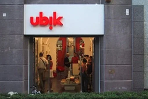 Ubreakifix store entrance with people inside, and the logo in red above the door.