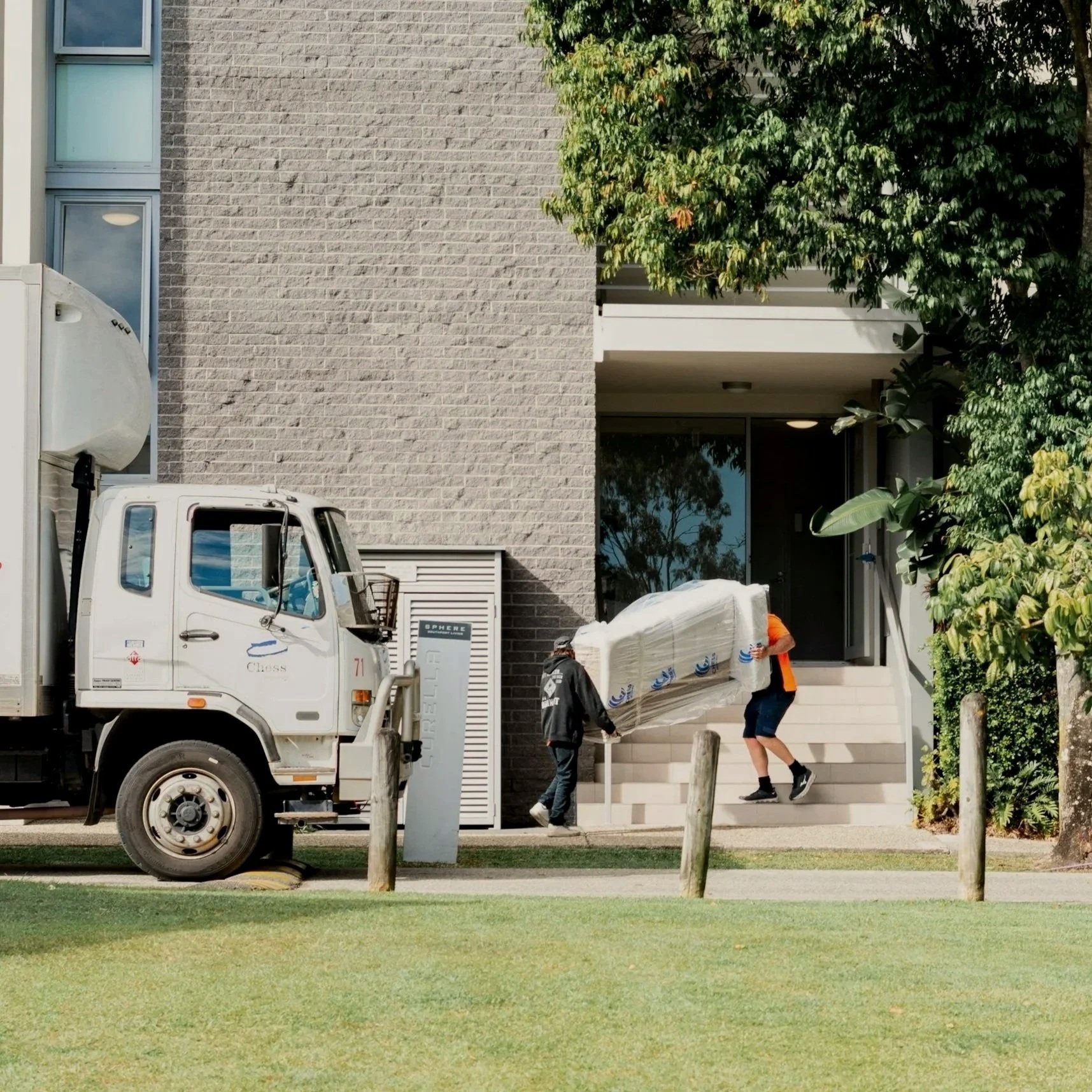 Moving truck outside an apartment building, ready for move-in cleaning