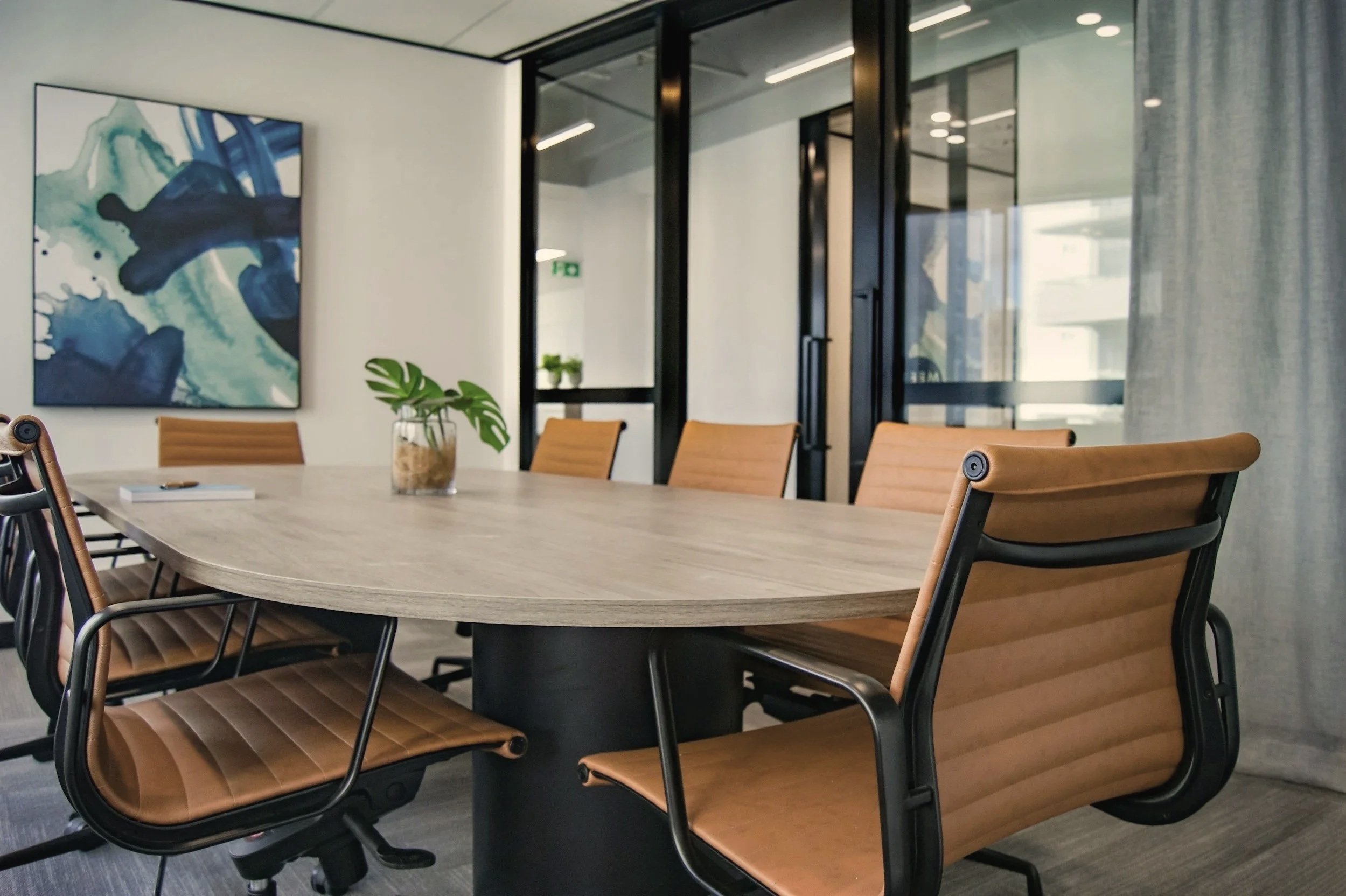 Modern office boardroom with clean, polished furniture
