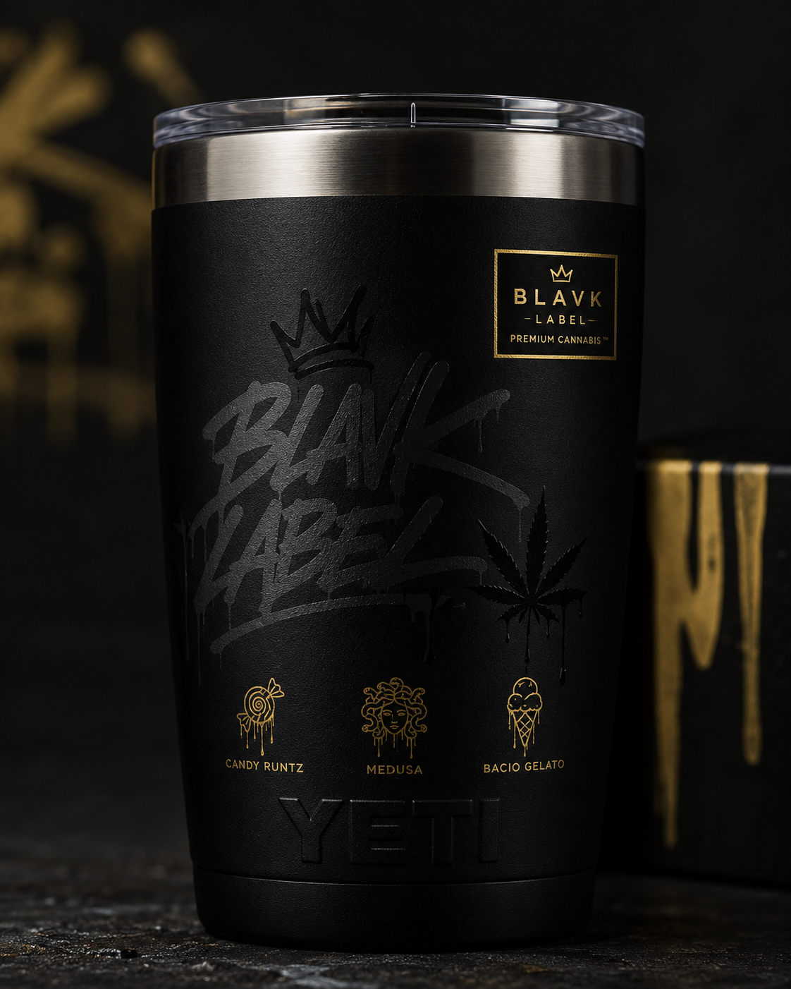 A black Yeti tumbler with gold and black branding, featuring a cannabis leaf and names of cannabis strains, with a Gold Blvck Label logo.