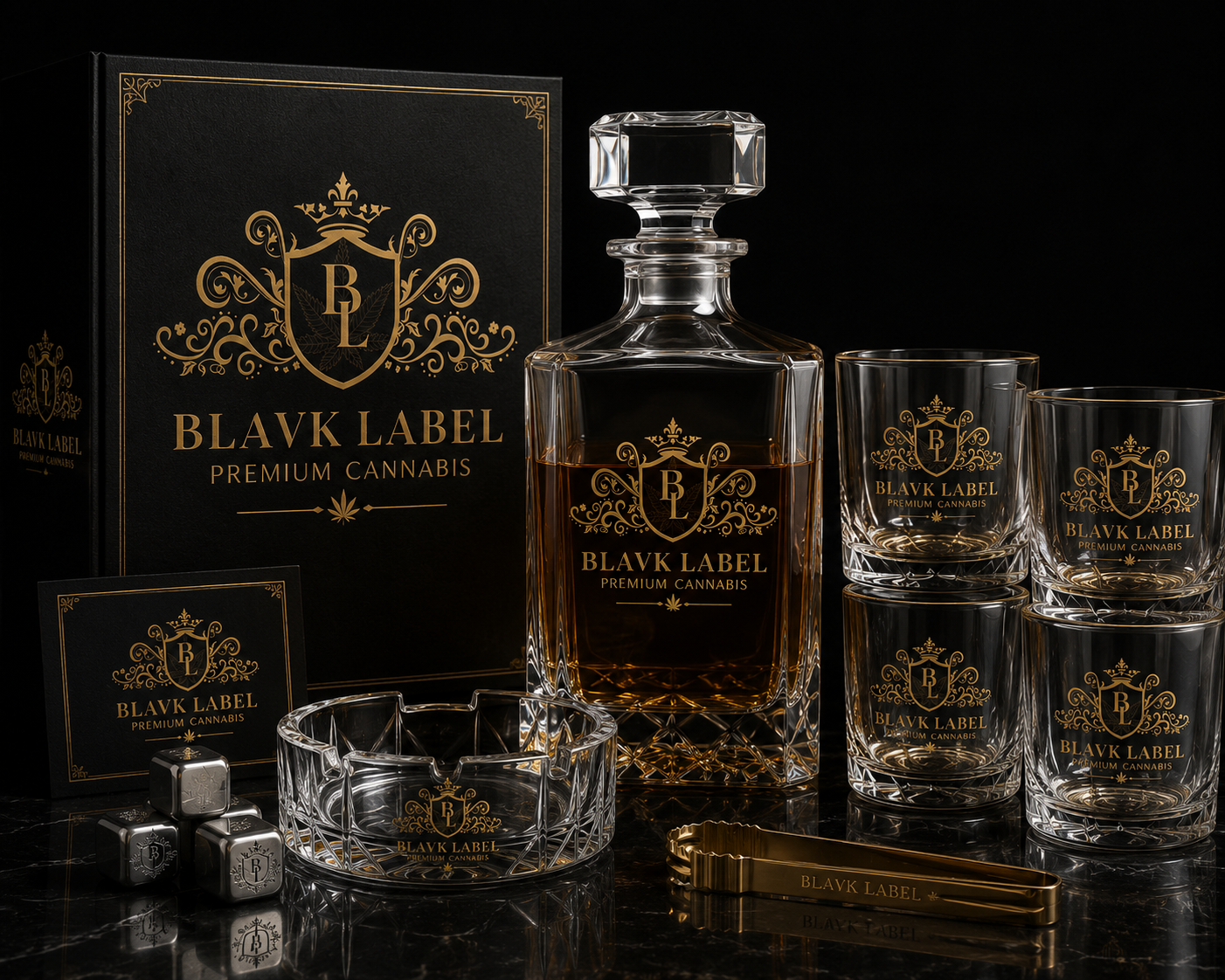 A black box with gold detailing and the logo 'Blavk Label Premium Cannabis,' a glass decanter with dark liquor and the same logo, four crystal glasses with the logo, a crystal ashtray with the logo, silver dice with the logo, and a golden pair of tongs with the logo, all displayed on a black surface.