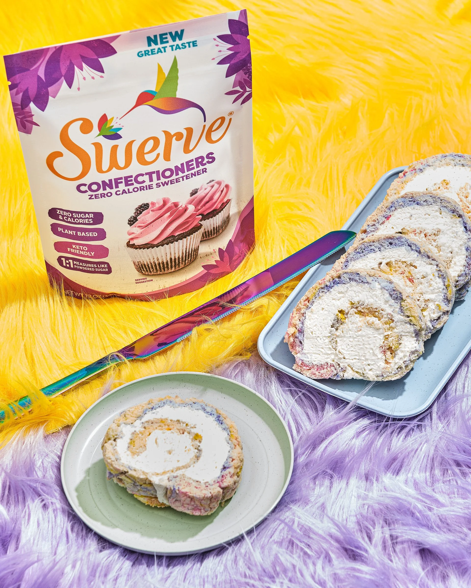 Close-up of a sliced homemade ice cream cake on a green plate, with a bag of Swerve confections in the background, on a purple fuzzy surface.