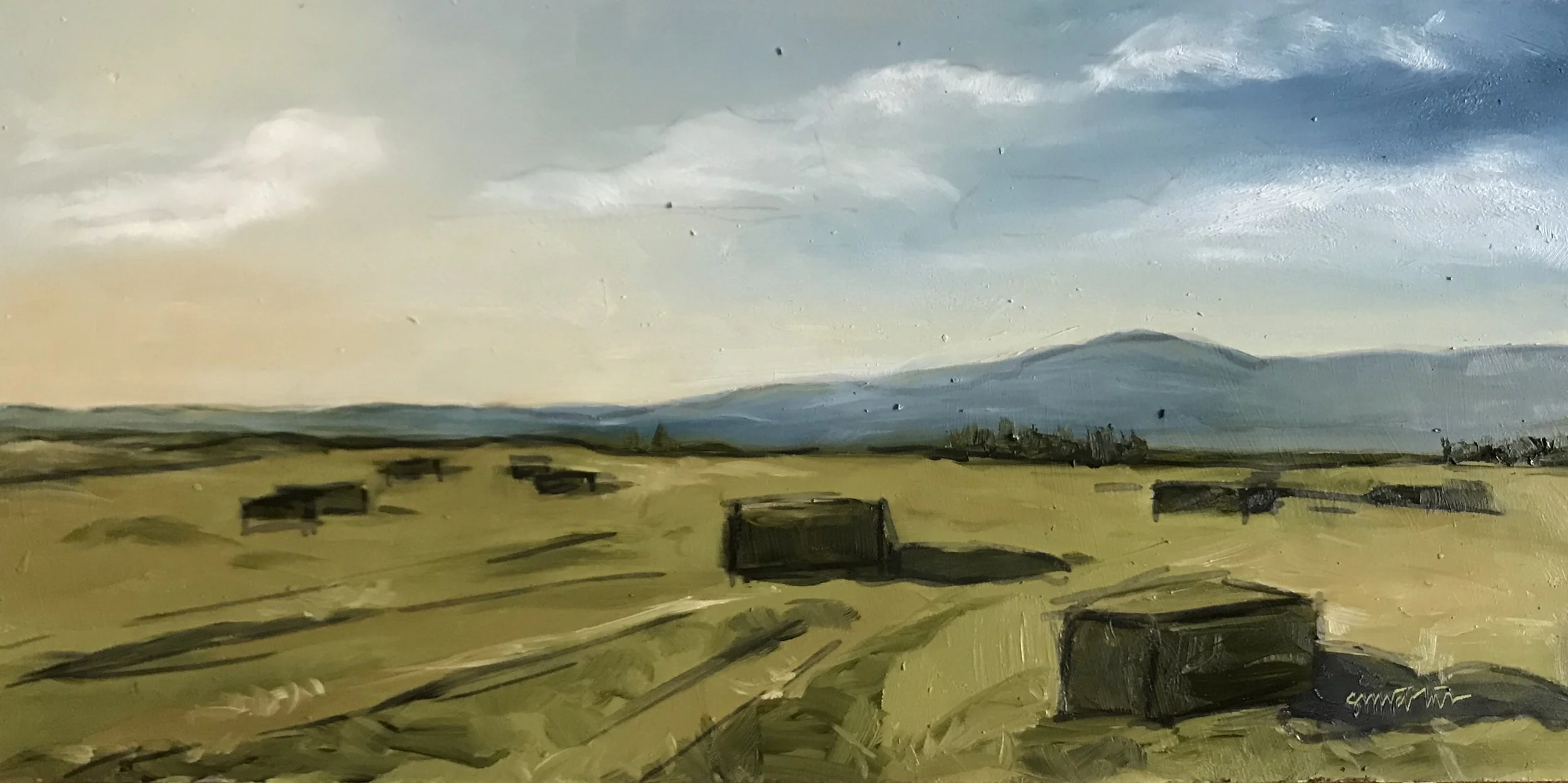 An oil painting of a rural landscape with a wide open field, scattered huts, and a mountain range in the background under a partly cloudy sky.