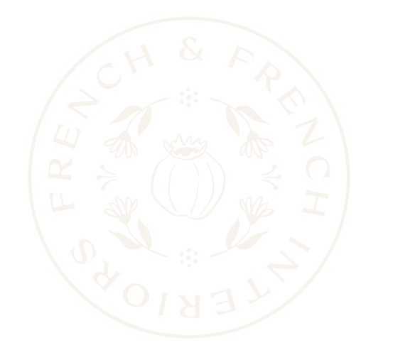 Circle logo with the text 'FRENCH & FRENCH INTERIORS' around the perimeter, featuring a pumpkin surrounded by flowers and leaves in the center.