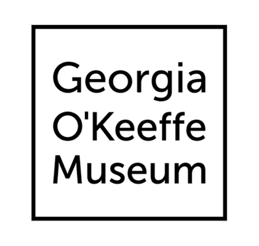 Sign for the Georgia O'Keeffe Museum with black border and white background.