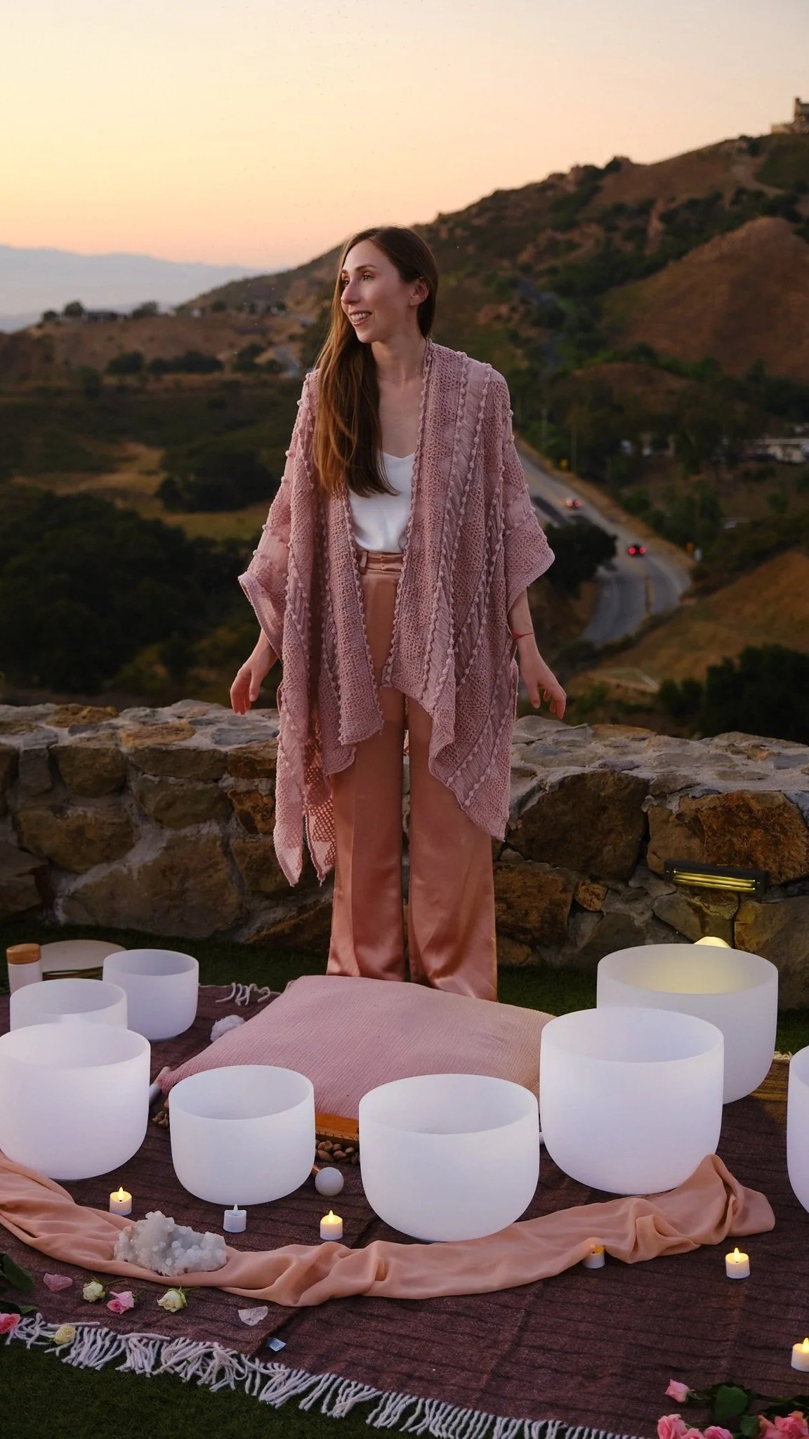 Personal branding photography during an outdoor sound bath session at sunset.