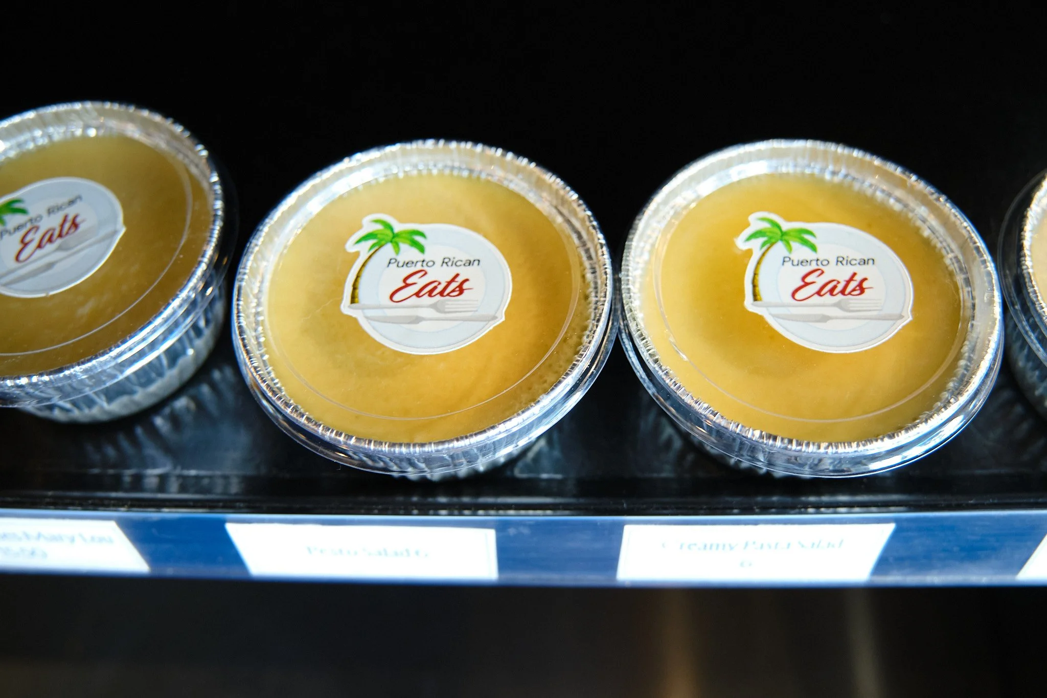 Containers of Puerto Rican dessert called 'Eat'.