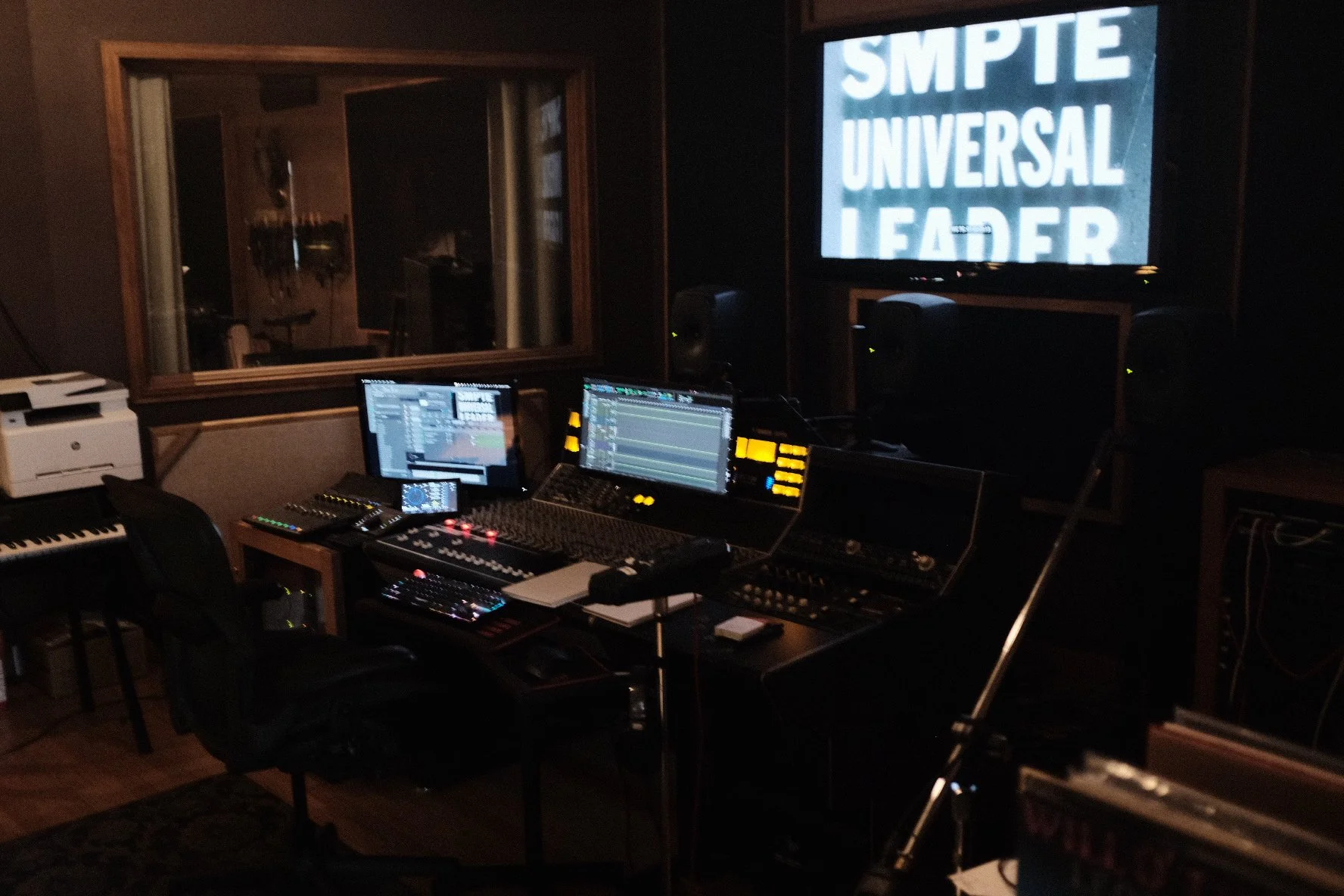 View of the screen and the window to the larger recording room.