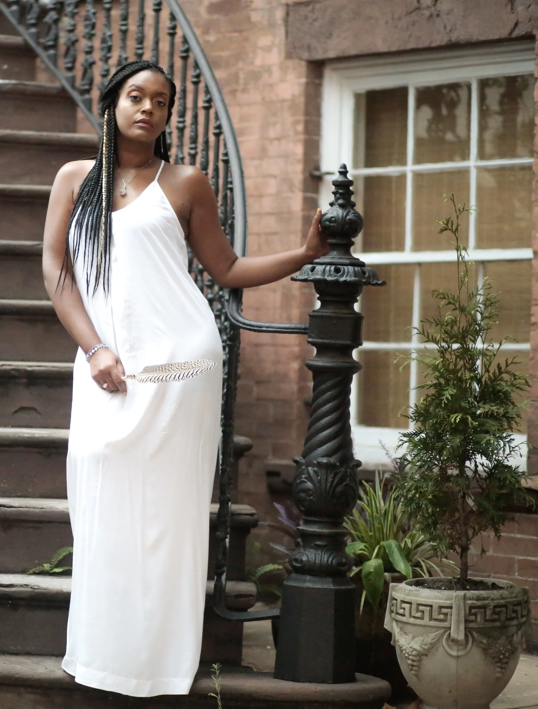 beautiful black women in white dress and braids