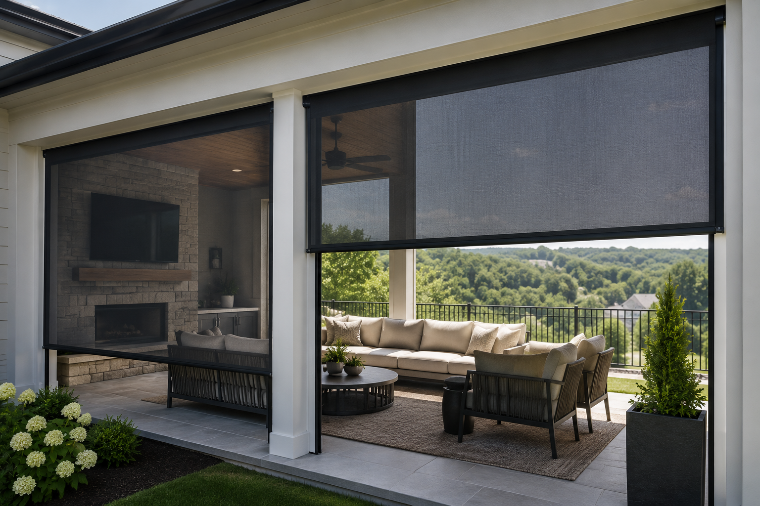 Covered outdoor patio with outdoor seating area, including a sofa and chairs, overlooking a lush green landscape with trees and hills.
