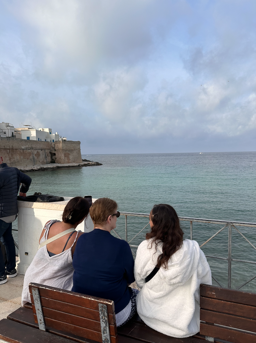 Prompt image from client - children with their grandmother on a trip to their homeland