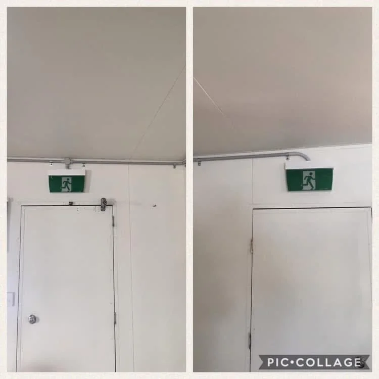 Comparison of two emergency exit signs above two different doors, with the left door showing a slightly bent sign and the right door showing a straight sign, both in a white indoor space.
