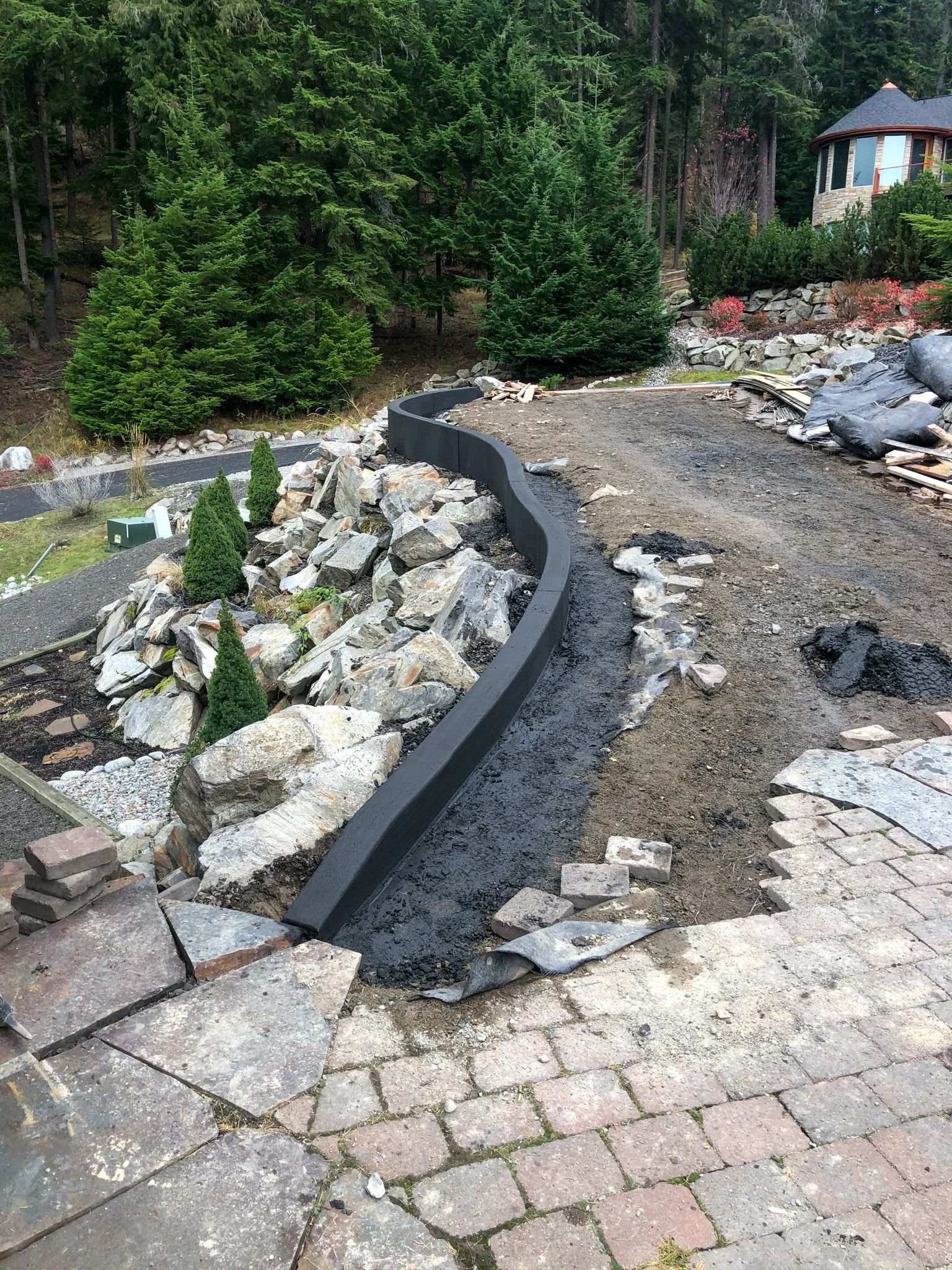 A delicately shaped curb formed for a custom home in North Idaho.