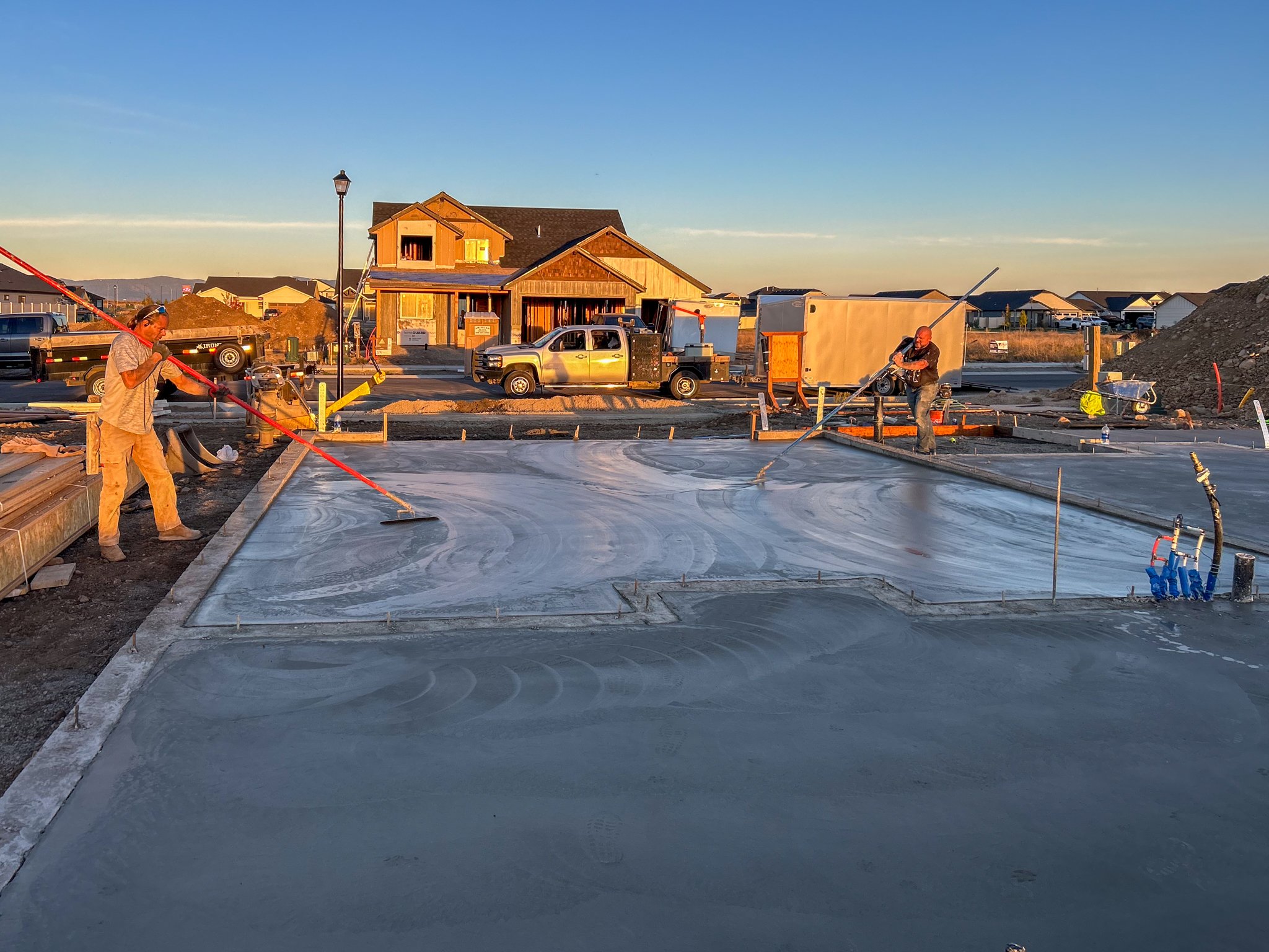 Pouring and smoothing a large slab foundation for a commercial building in Spokane.