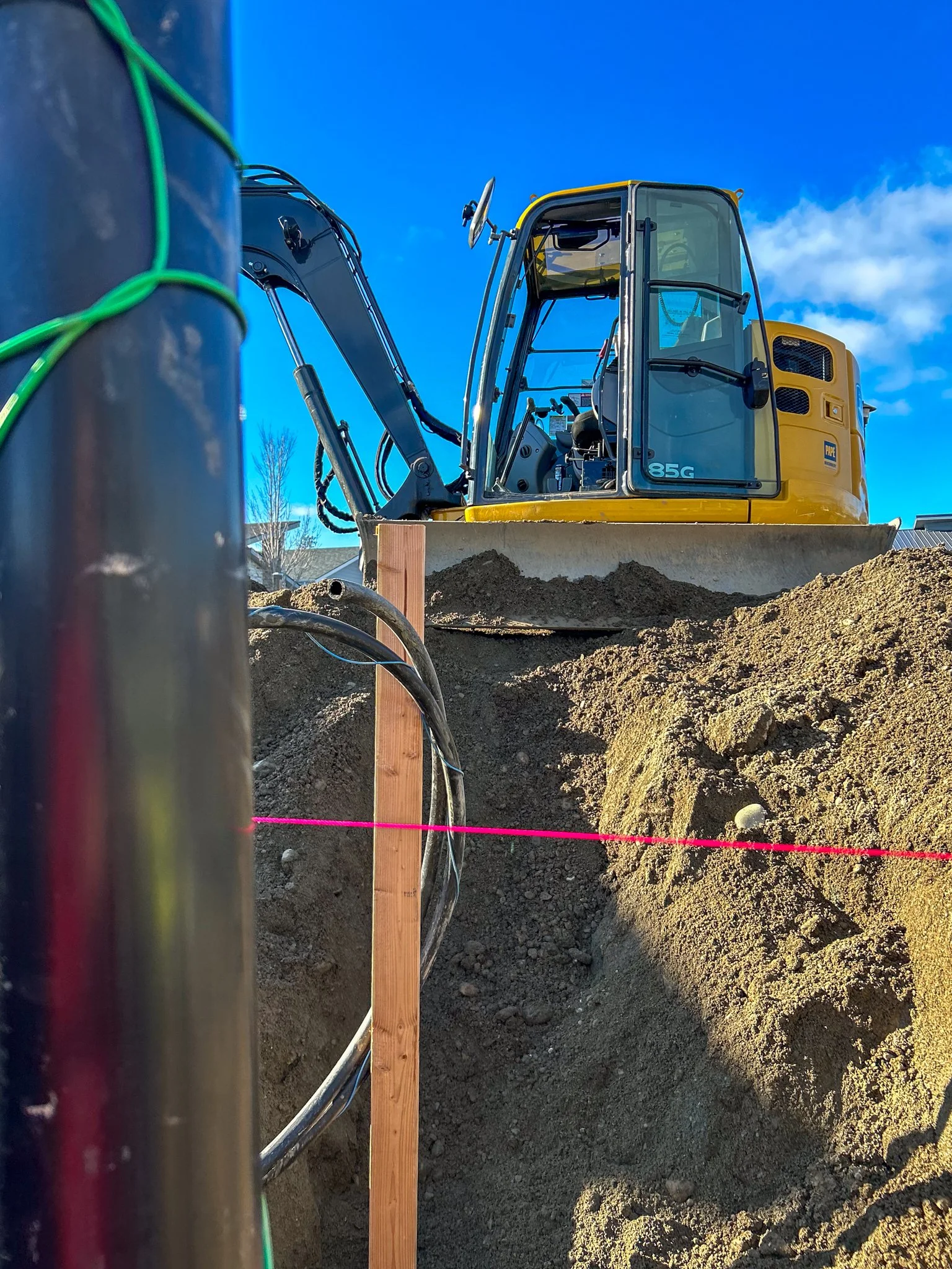 Maintaining proper grade while excavating a building site in North Idaho.