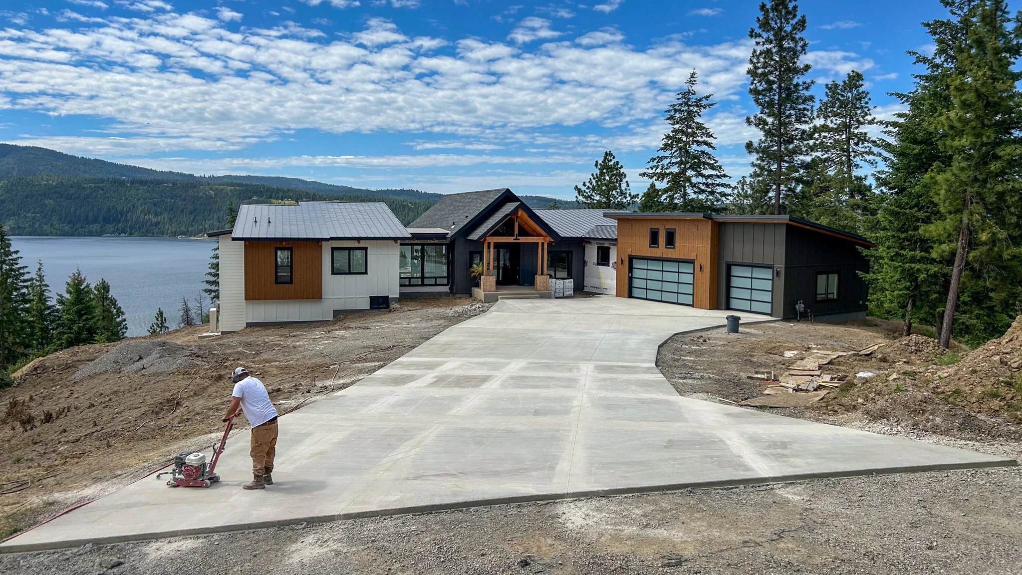 Finishing a newly poured concrete driveway at one of the custom homes we build near the Snake River in Idaho.
