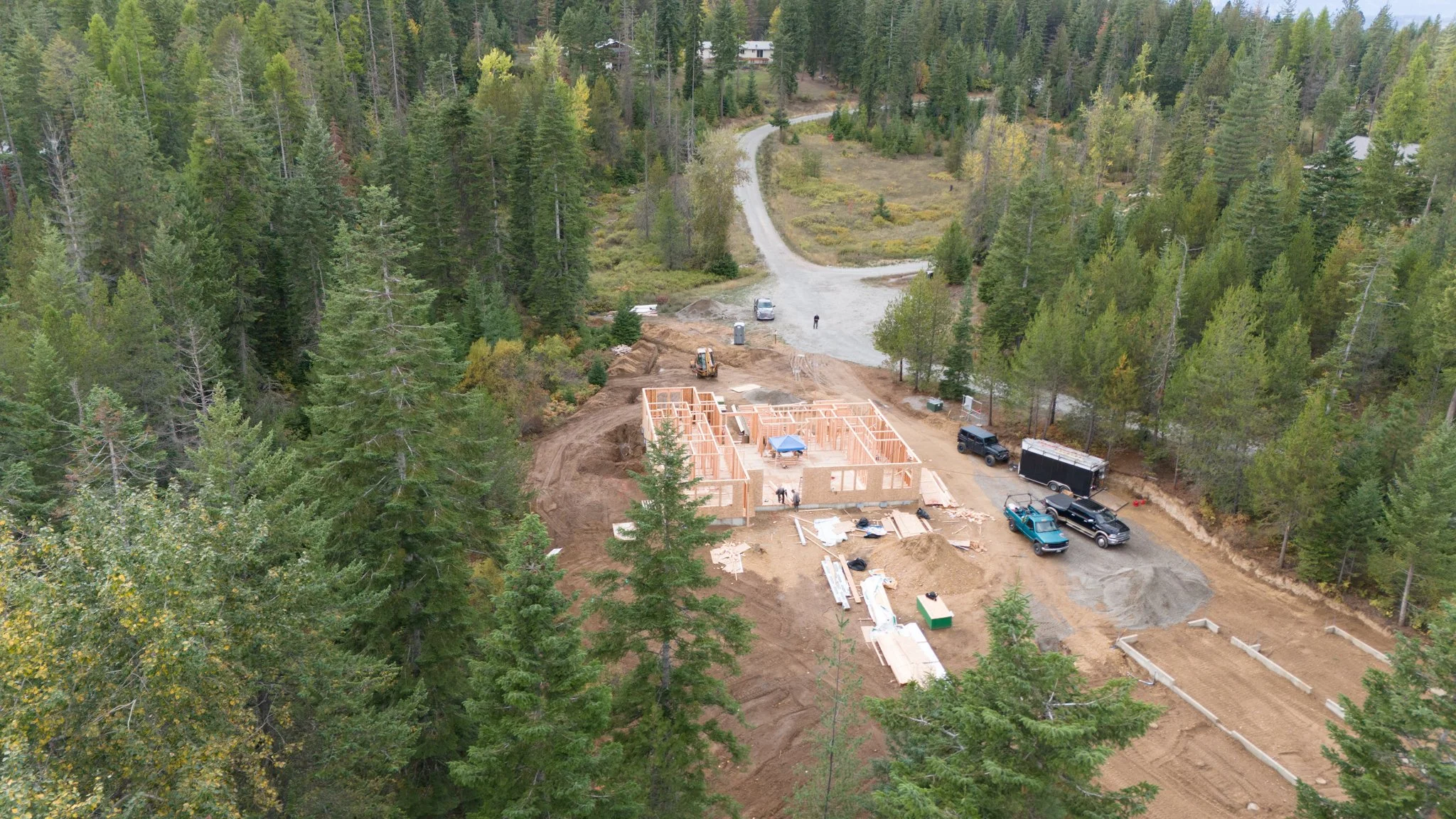 An aerial drone view of a custom home building site near Sandpoint, Idaho.
