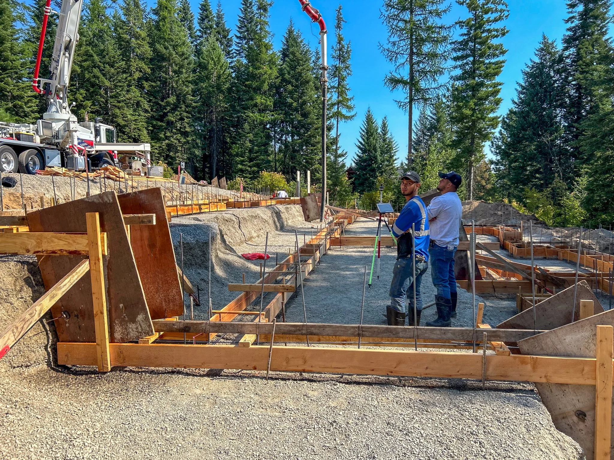 Wood forms being constructed for a complex custom home foundation in North Idaho.
