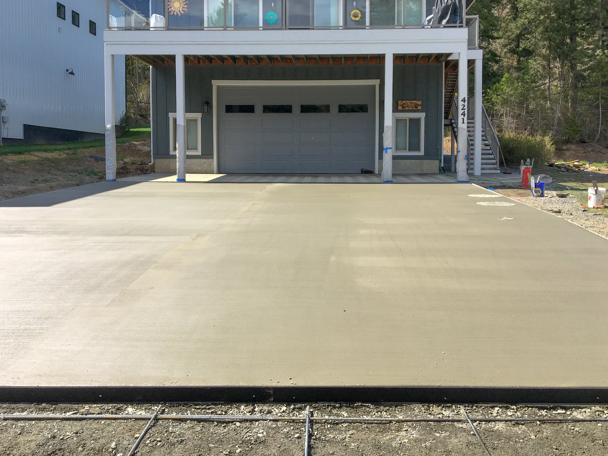 Flatwork: Newly poured concrete driveway for a home in North Idaho.