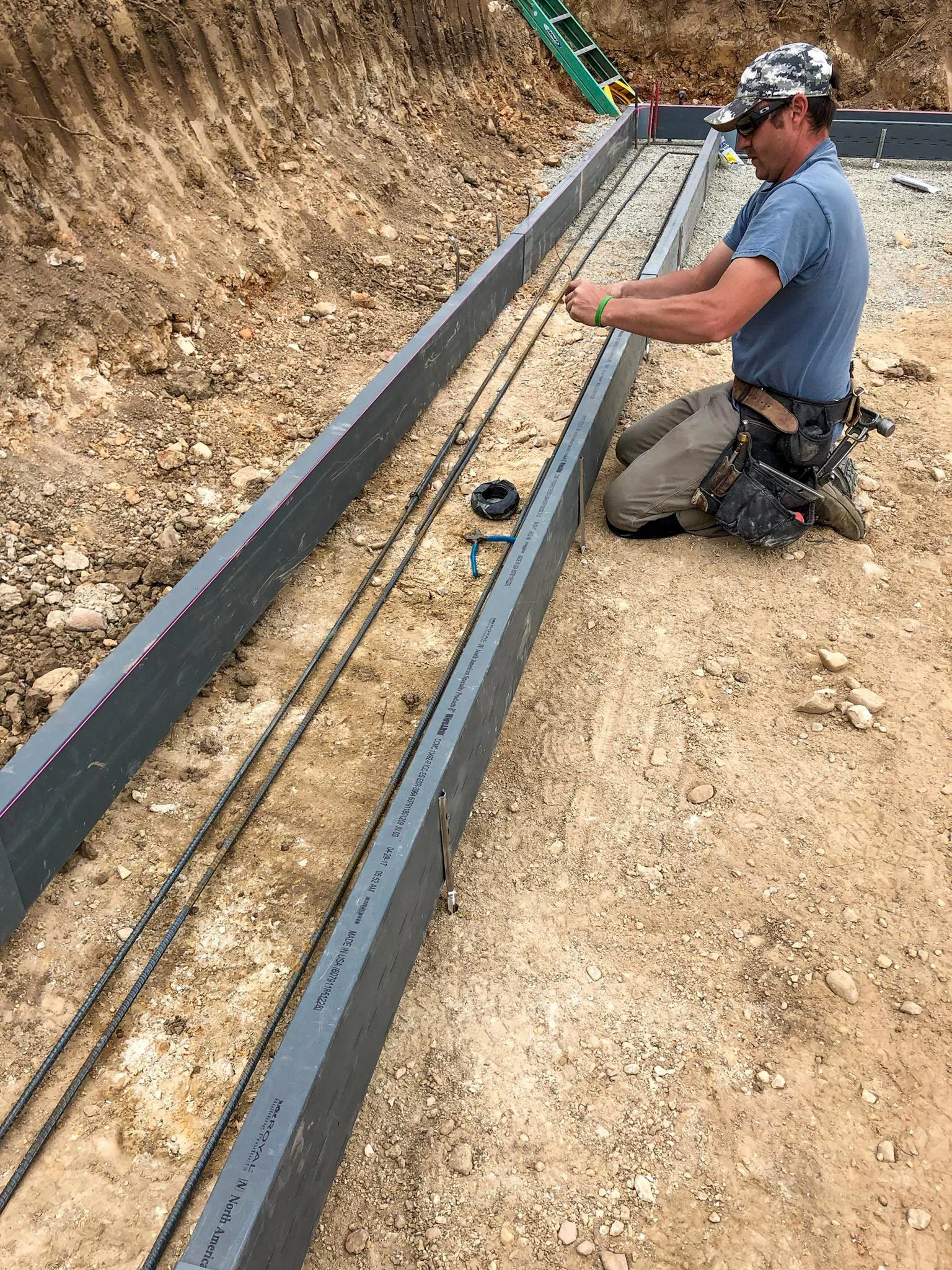Snapping the rebar into Form-A-Drain polymer forms to build the footings for a custom homes in Coeur D'Alene, Idaho.
