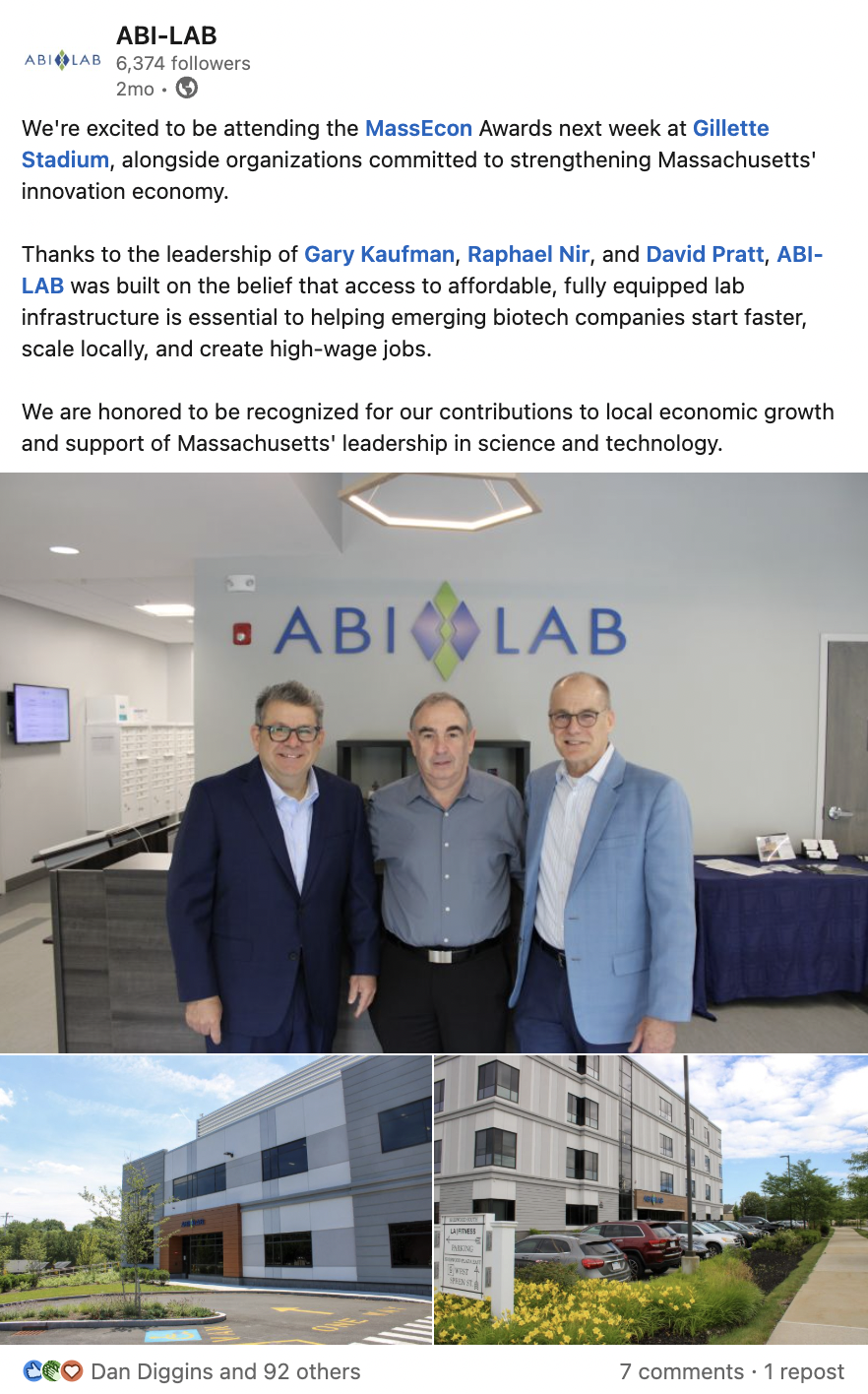 Group photo of three men in suits standing inside ABi-LAB facility, with ABi-LAB logo on wall behind them. Exterior images of modern lab and office building with parking lot, landscaping, and clear sky.
