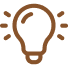 Outline of a light bulb with small spark lines indicating brightness.