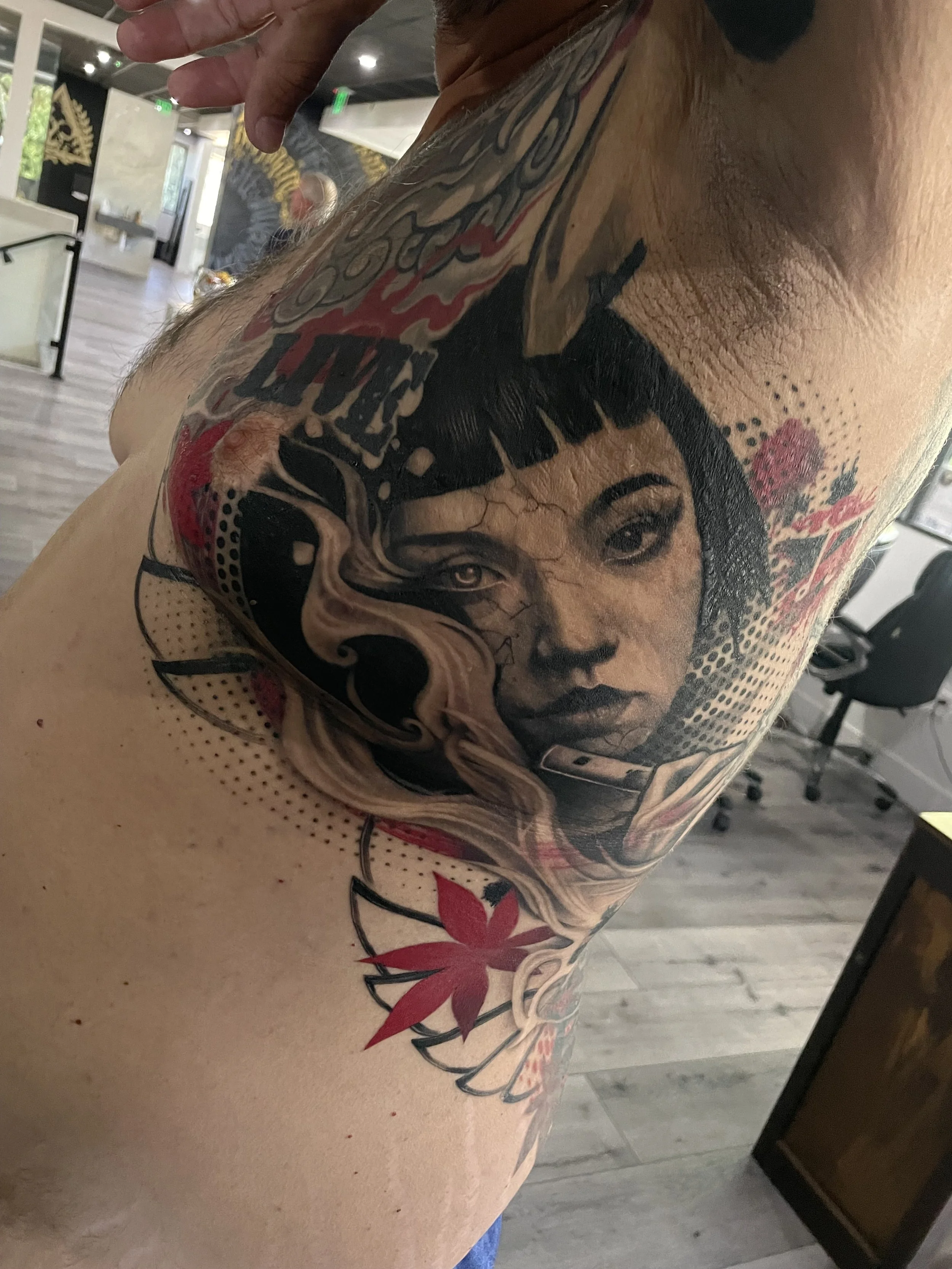 Colorful illustrative woman portrait tattoo on thigh