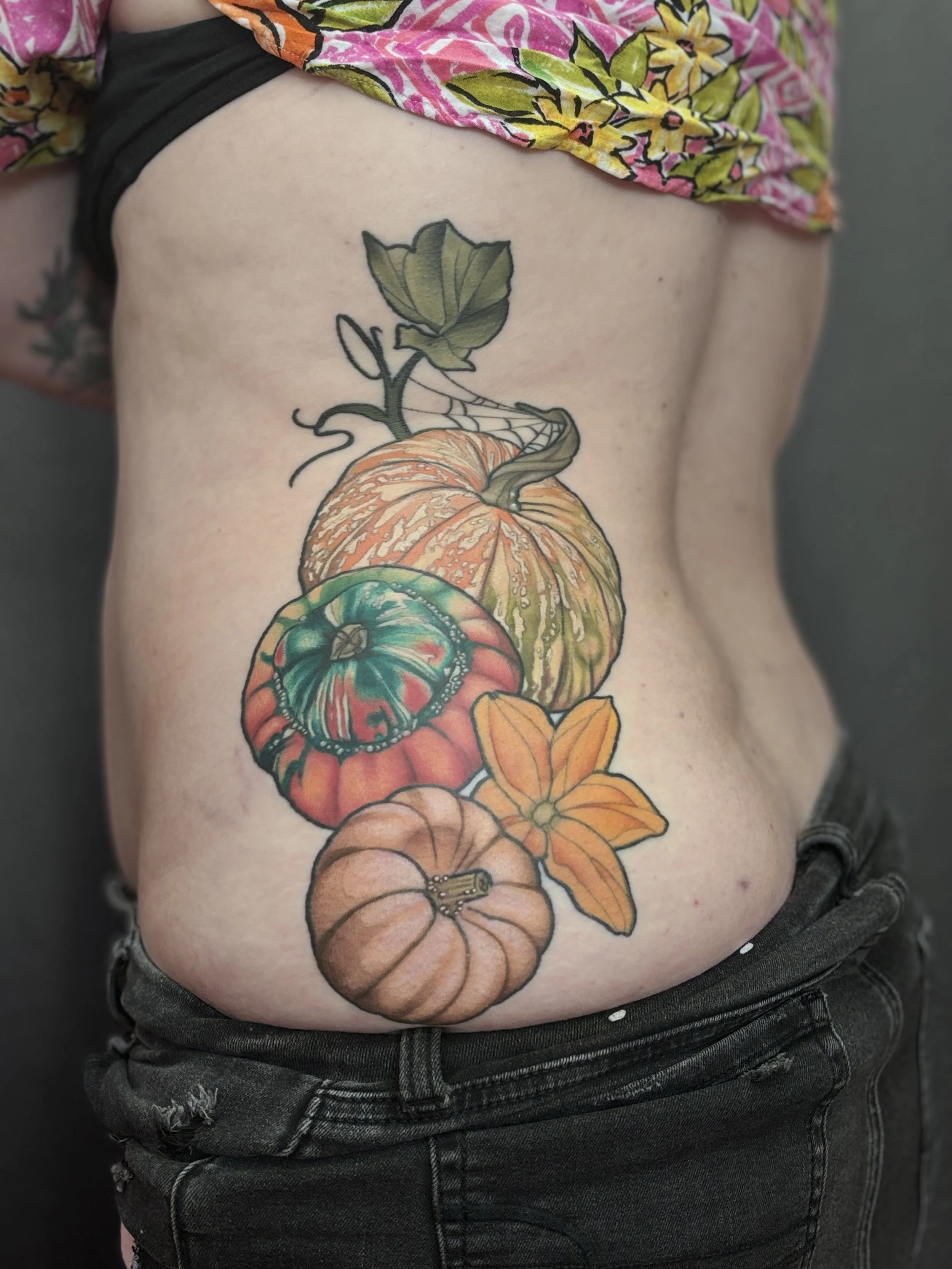 Color neo-traditional floral tattoo on hip