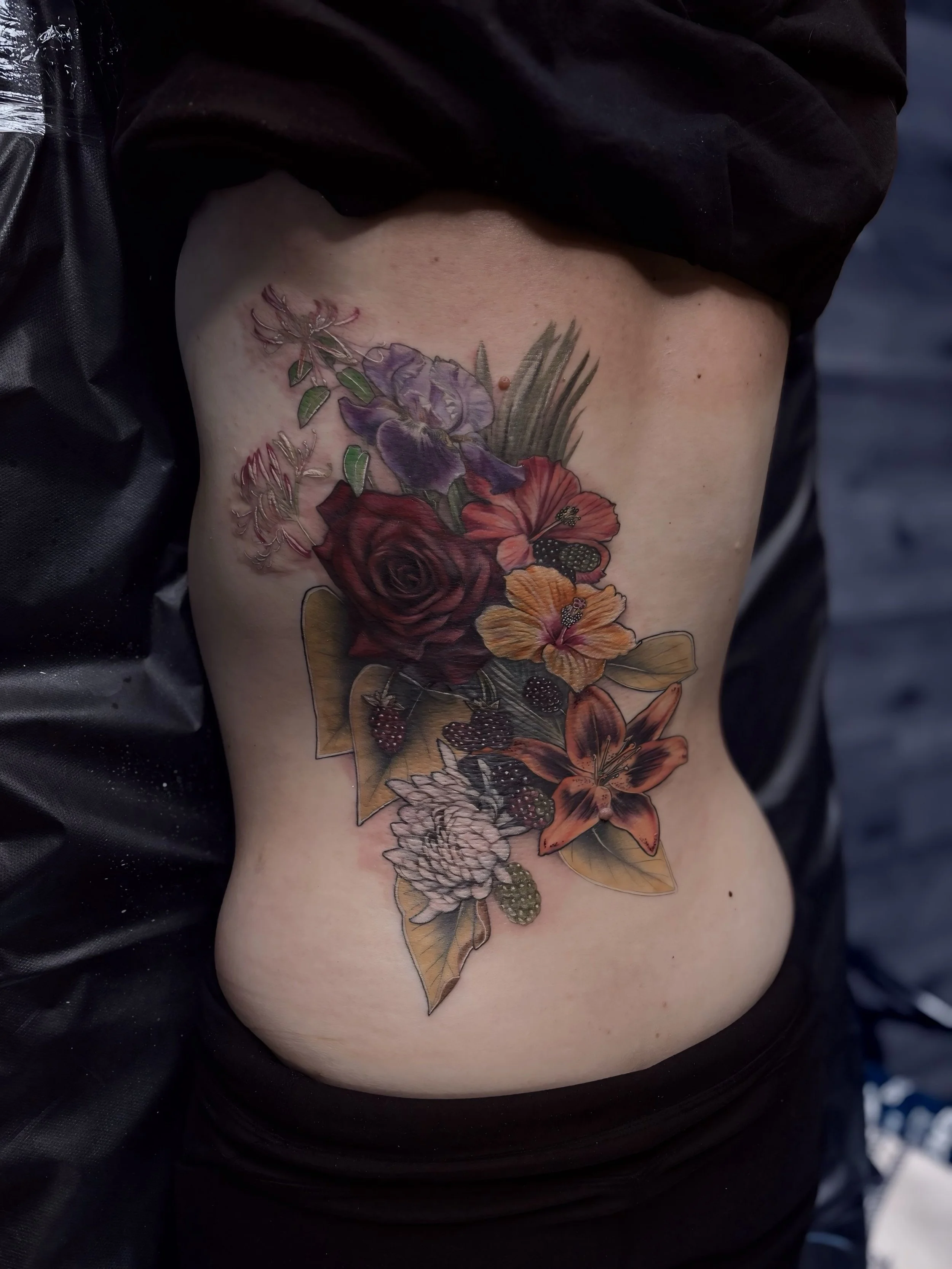 Colorful floral back tattoo