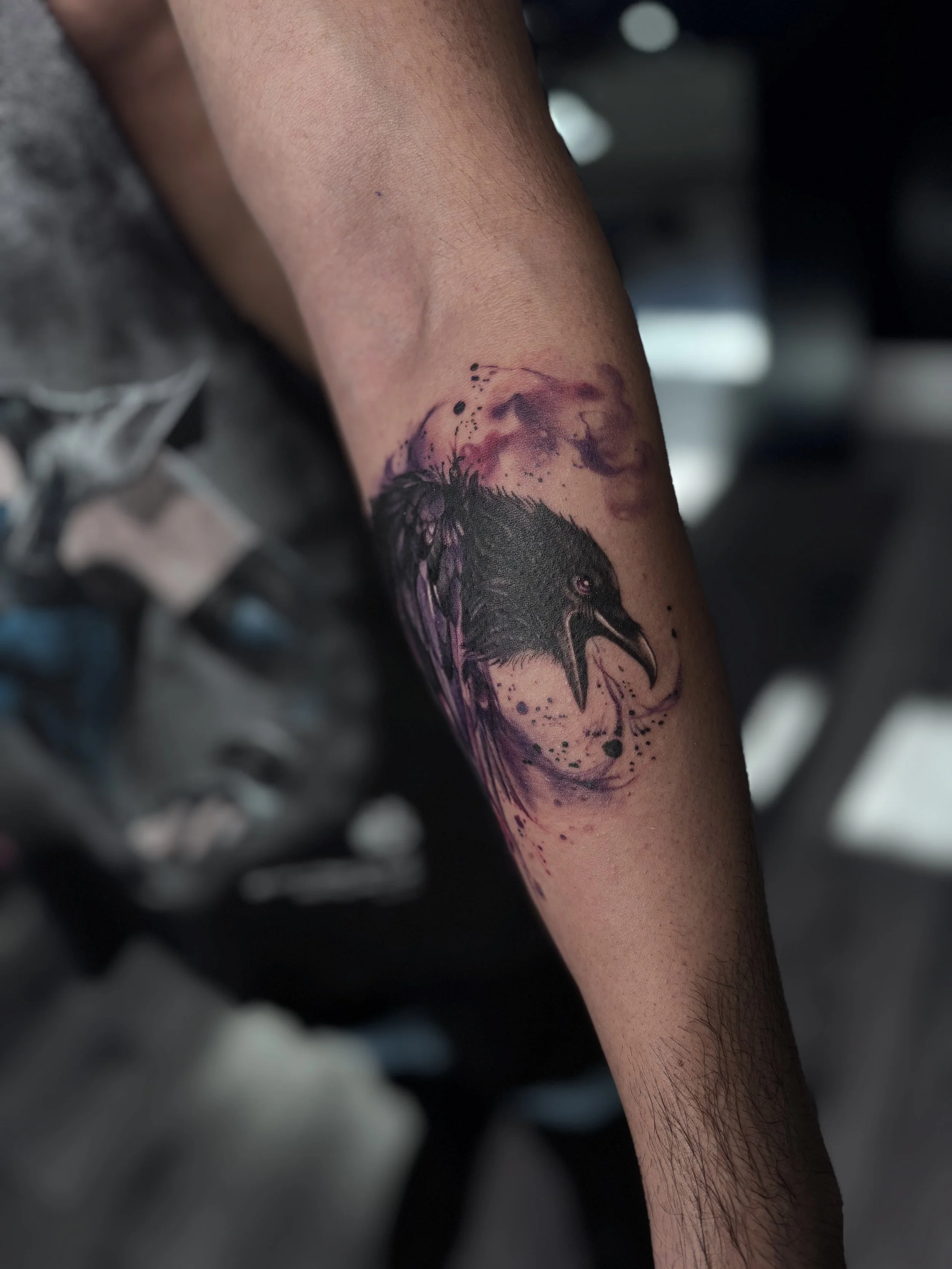 Black and gray illustrative tattoo on forearm