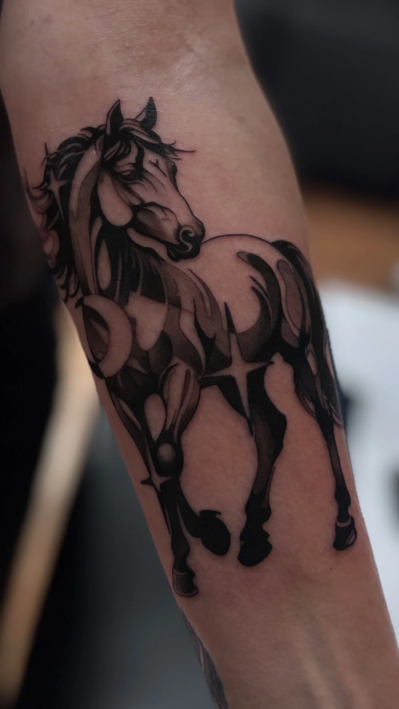 Blackwork ornamental tattoo on arm