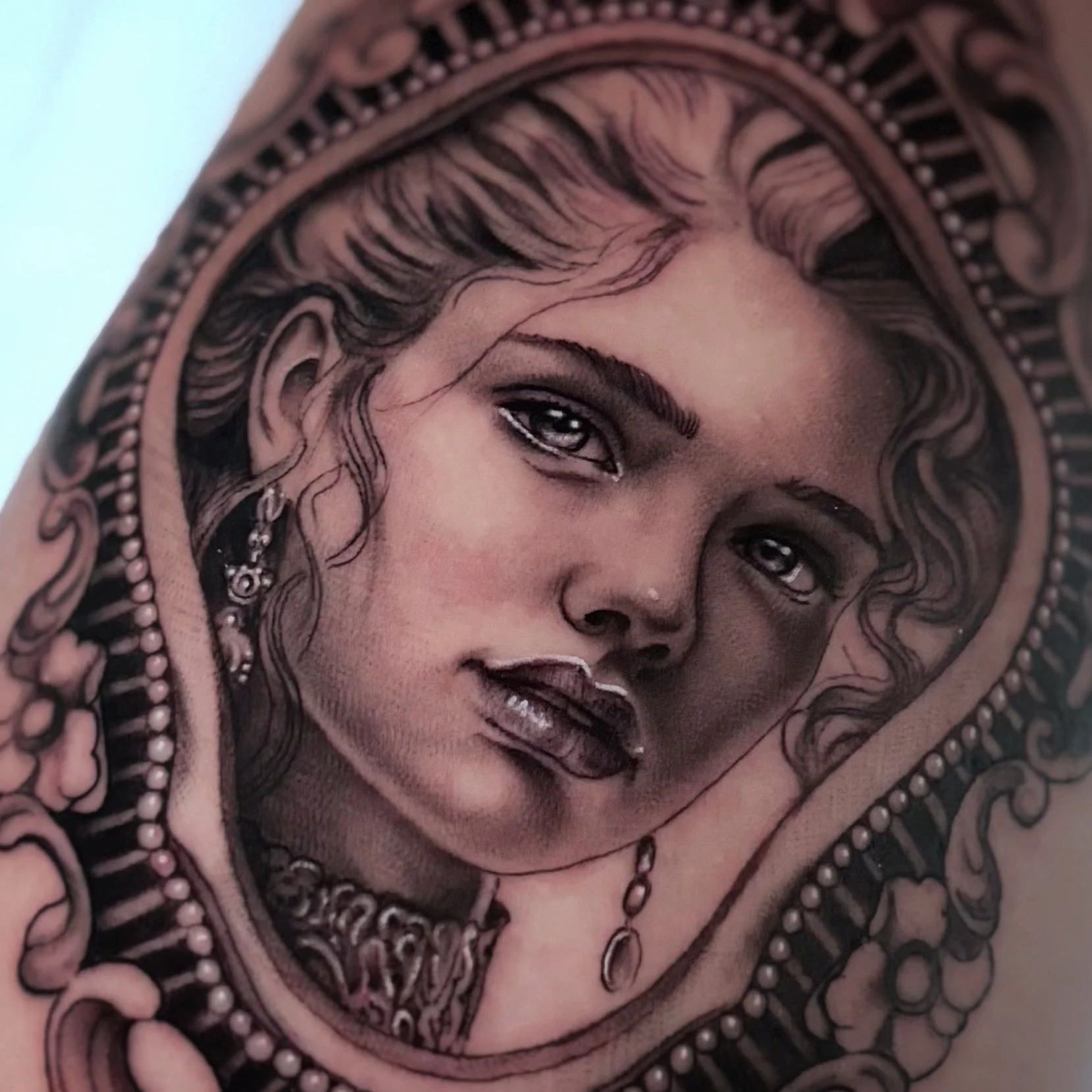 Black and gray illustrative woman portrait tattoo