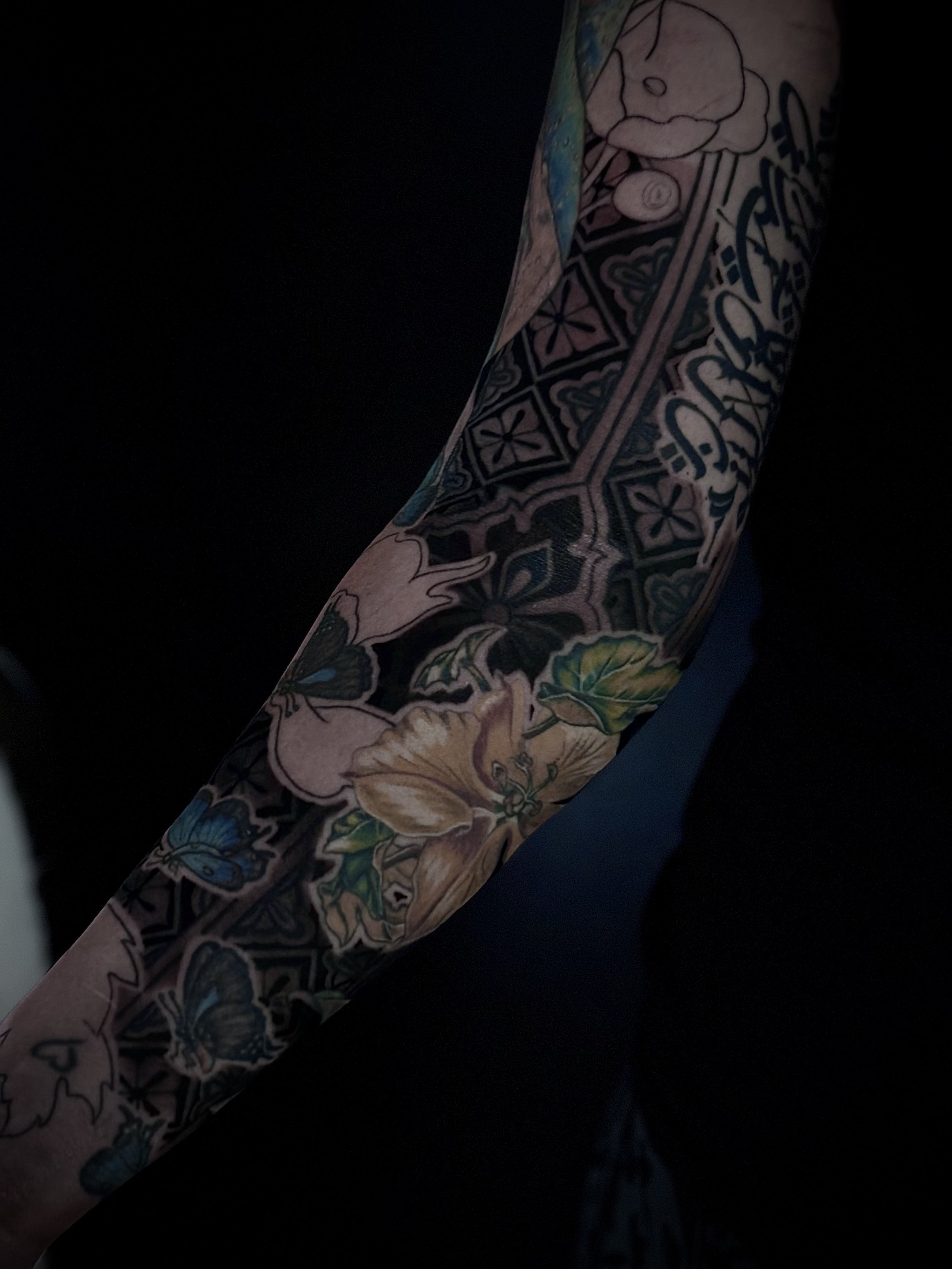 Color illustrative floral sleeve tattoo
