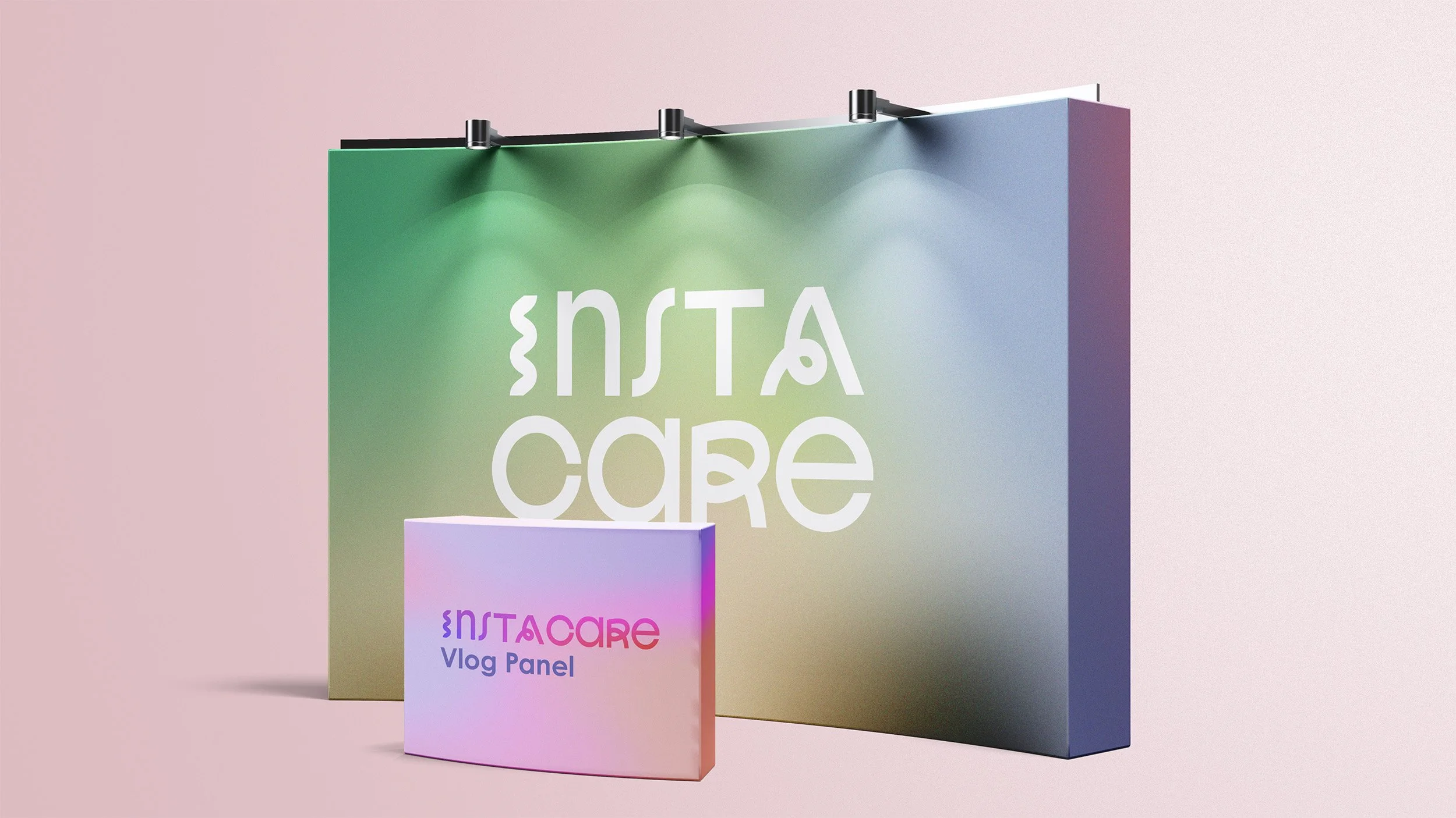 Colorful display with a large horizontal sign reading 'instacare' and a smaller rectangular sign below that says 'INSTACARE Vlog Panel,' both set against pastel pink, green, blue, and purple backgrounds.