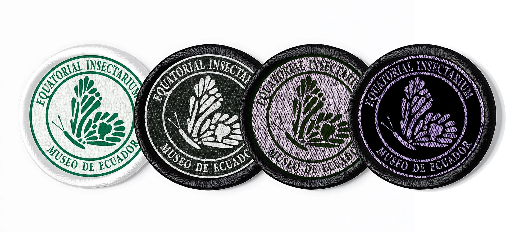 Four embroidered patches from Museo de Ecuador, each with a plant-butterfly motif and the text 'EQUATORIAL INSECTARIUM MUSEO DE ECUADOR', in different colors: white, green, black, purple, and pink.