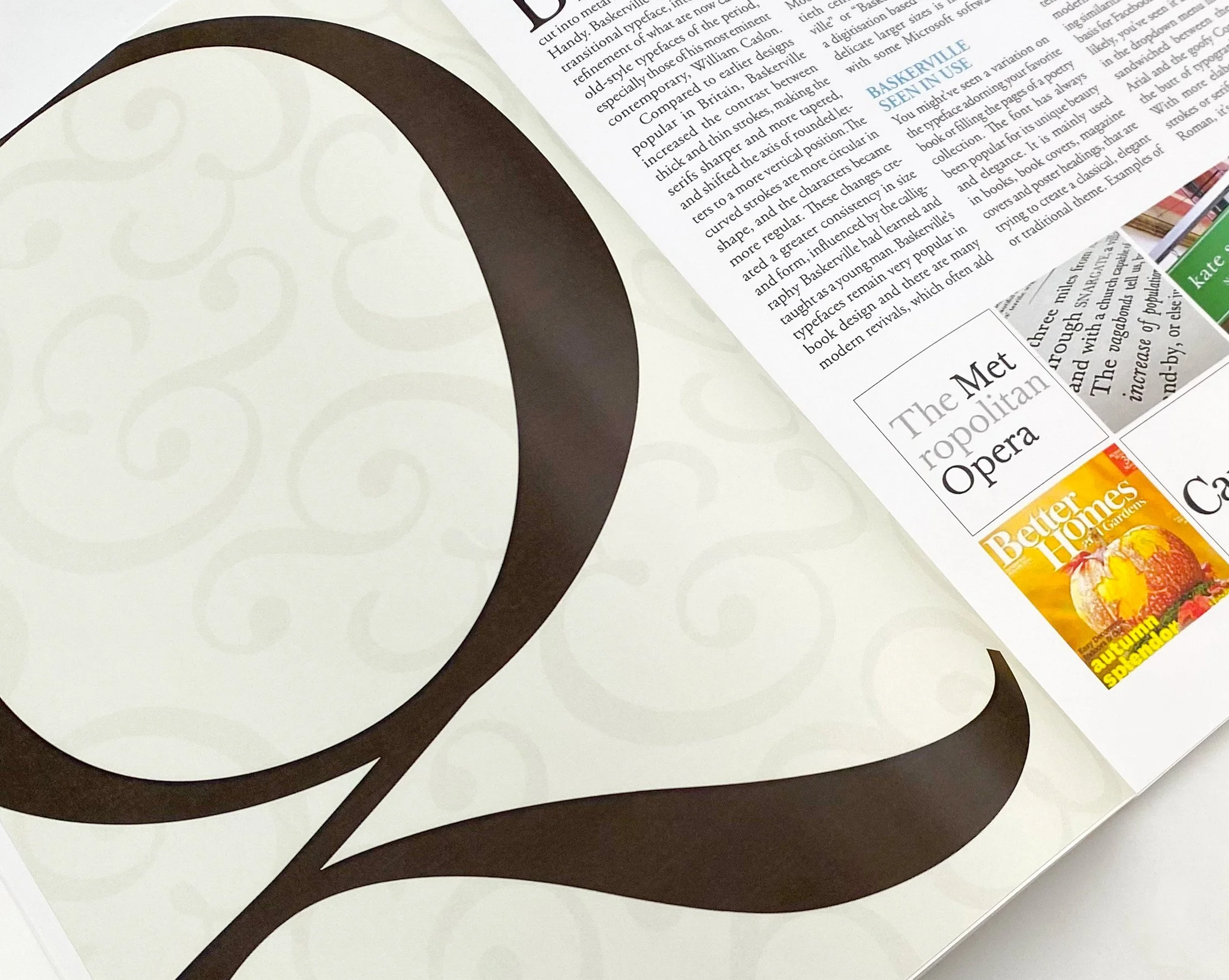 A close-up picture of a magazine spread. On the left page is a large dark brown "Q" in front of a cream beige background with slightly visible faded ampersands. The right page shows a three column text broken up by a phrase ' BASKERVILLE SEEN IN USE'