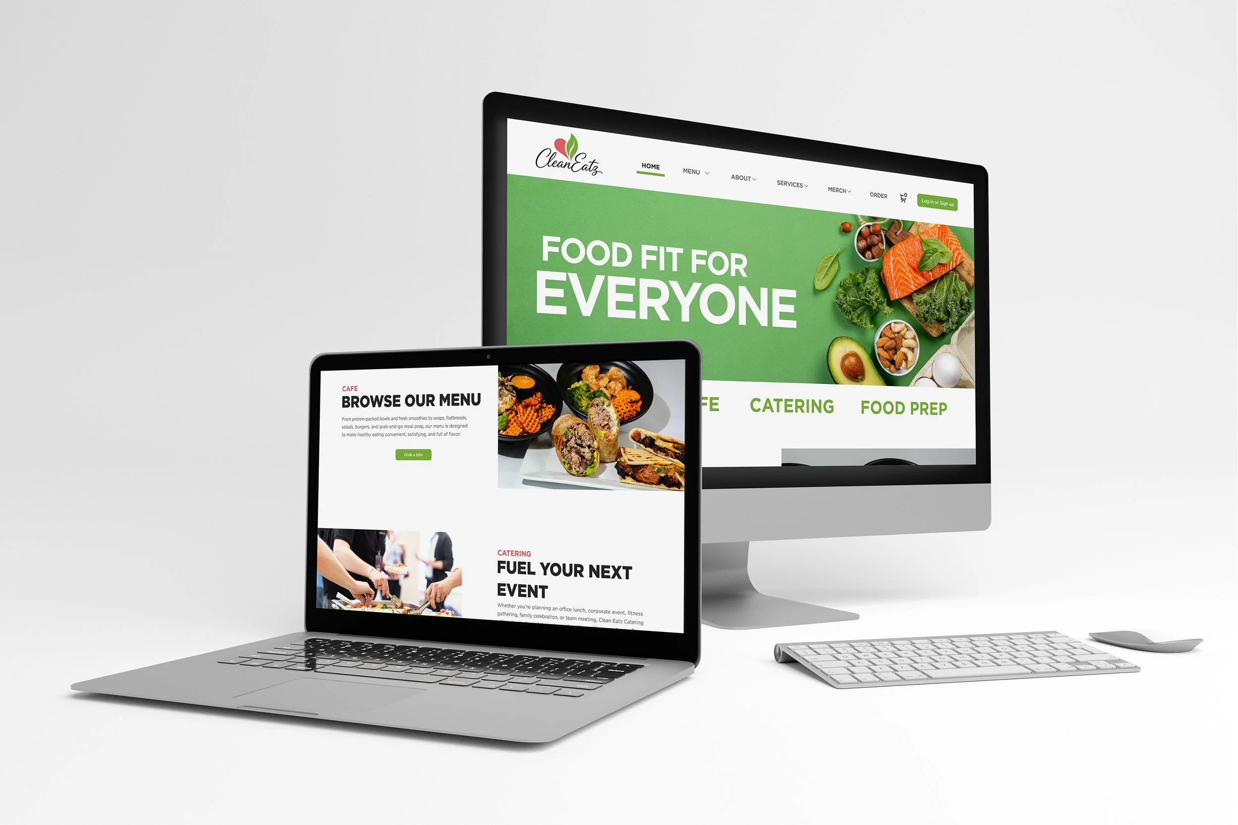 A Mac desktop monitor and a laptop displaying a website for a food catering business called 'CleanEatz', with images of healthy food and kitchen scenes.