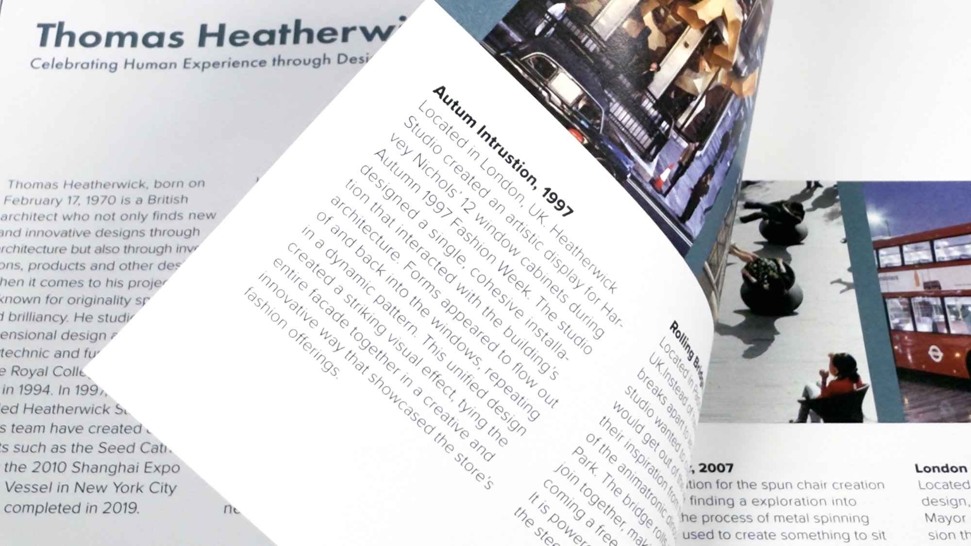 A close up image showing an open brochure flipping between pages featuring text about Thomas Heatherwick and his design work, with images of architectural projects and a person seated on a bench outside.