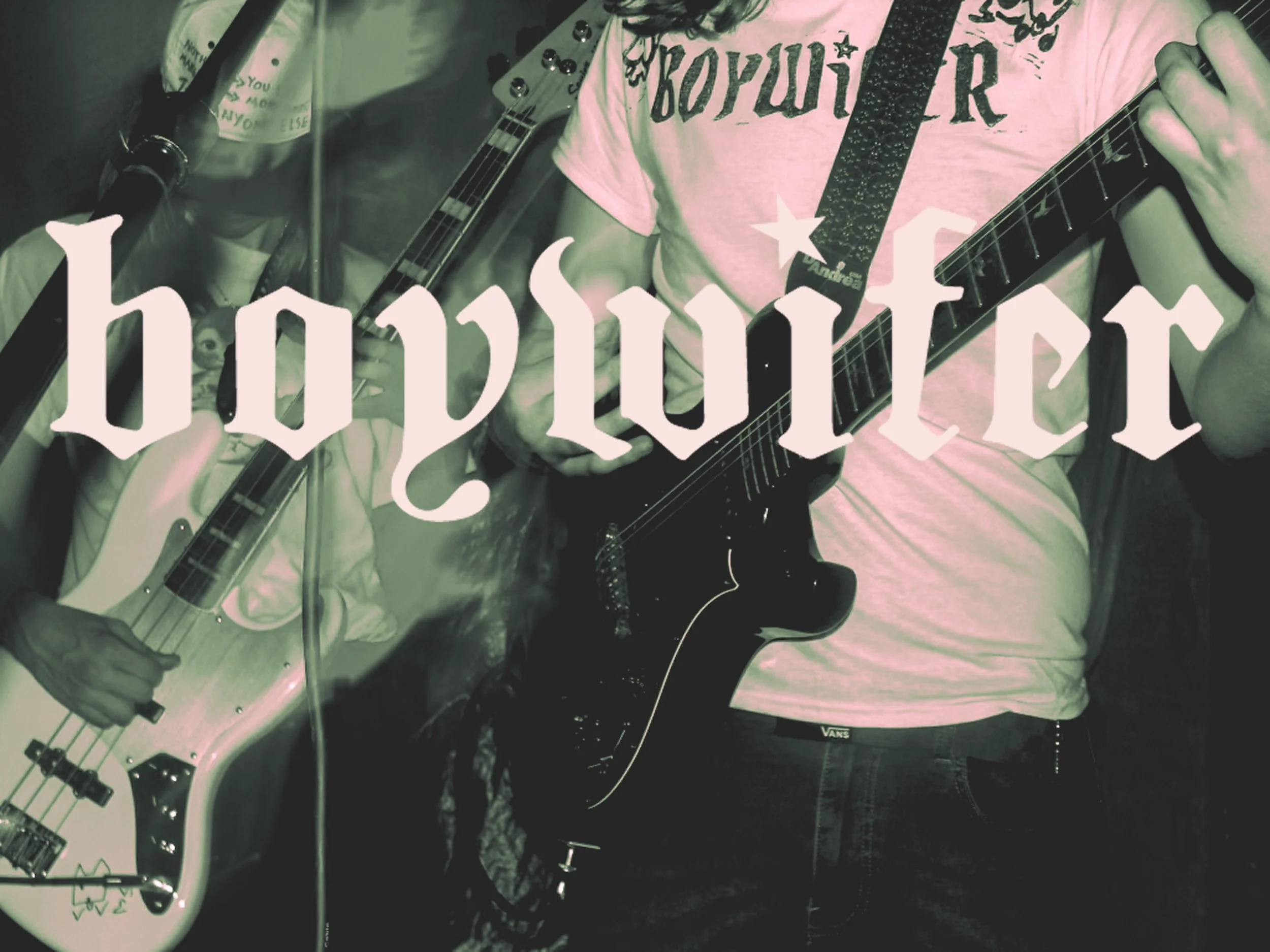 Person playing an electric guitar with another person holding a bass guitar nearby, with the word "boywifer" overlaid across the image.