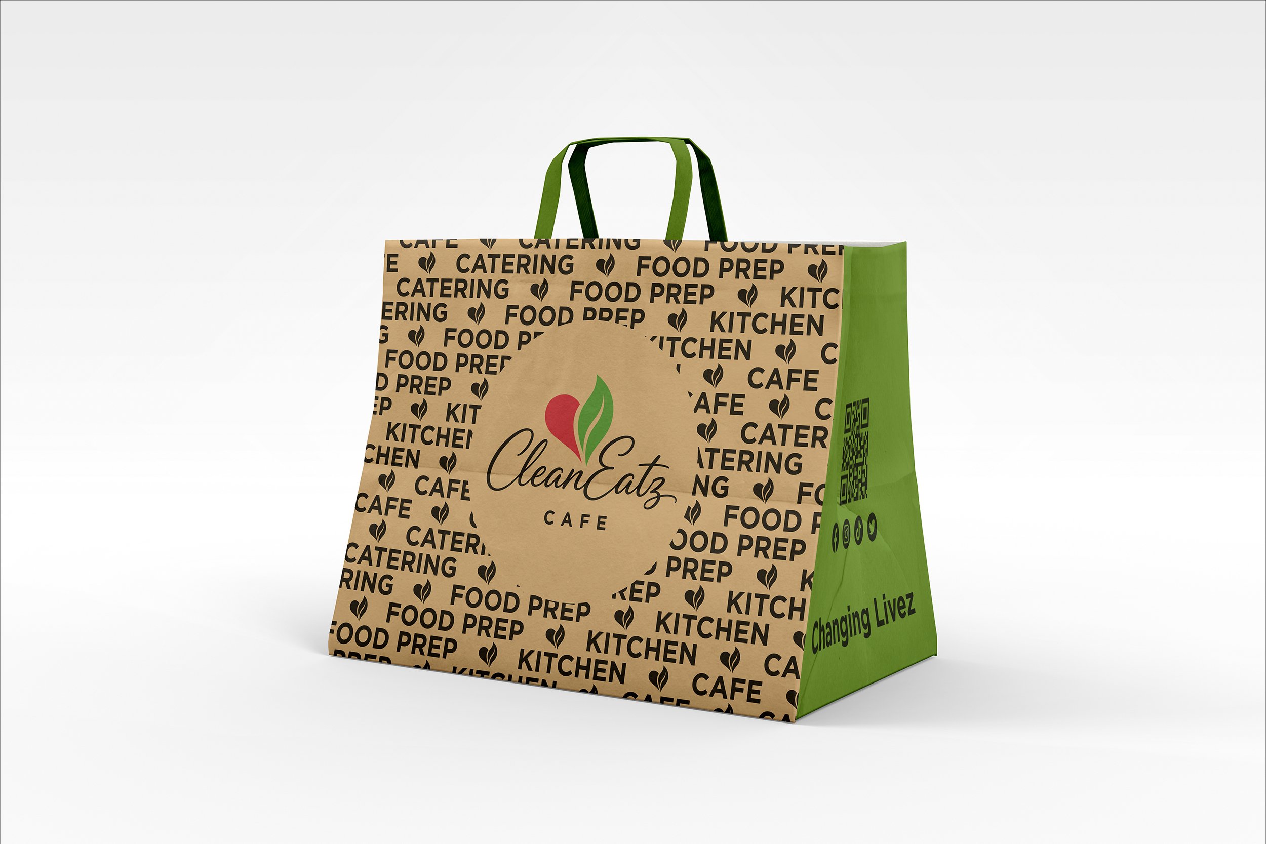 Colorful paper bag with green and brown sides, featuring black text and icons related to food and catering, with the phrase 'Changing Livez' on the green side while the from reads "CleanEatz Cafe".