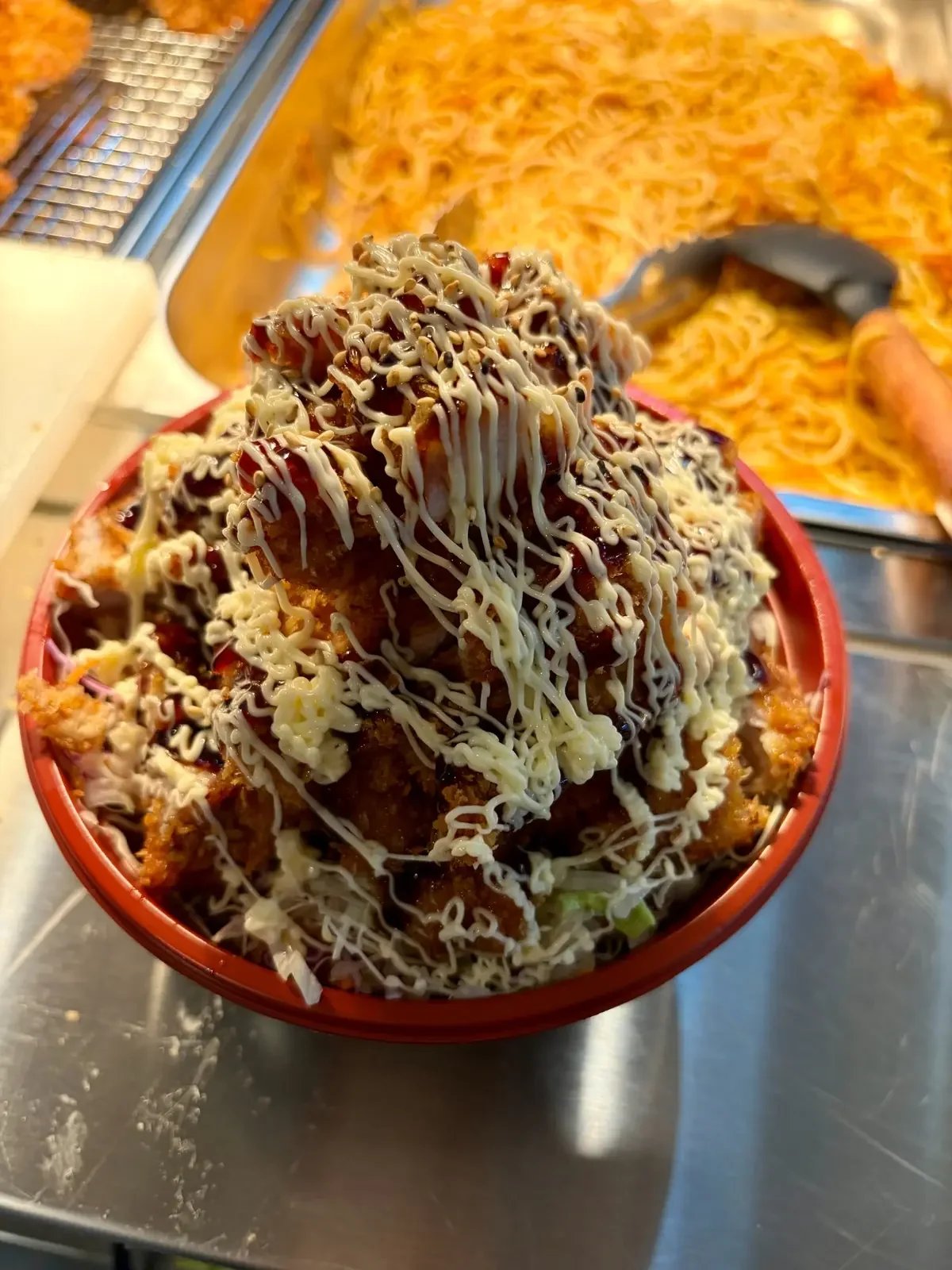 Chicken katsu bowl topped with Japanese sauce and mayonnaise at One Sushi Wigram.