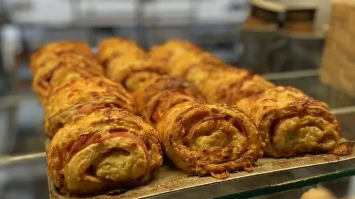 Homemade ham and cheese scrolls available from Cocoa Black
